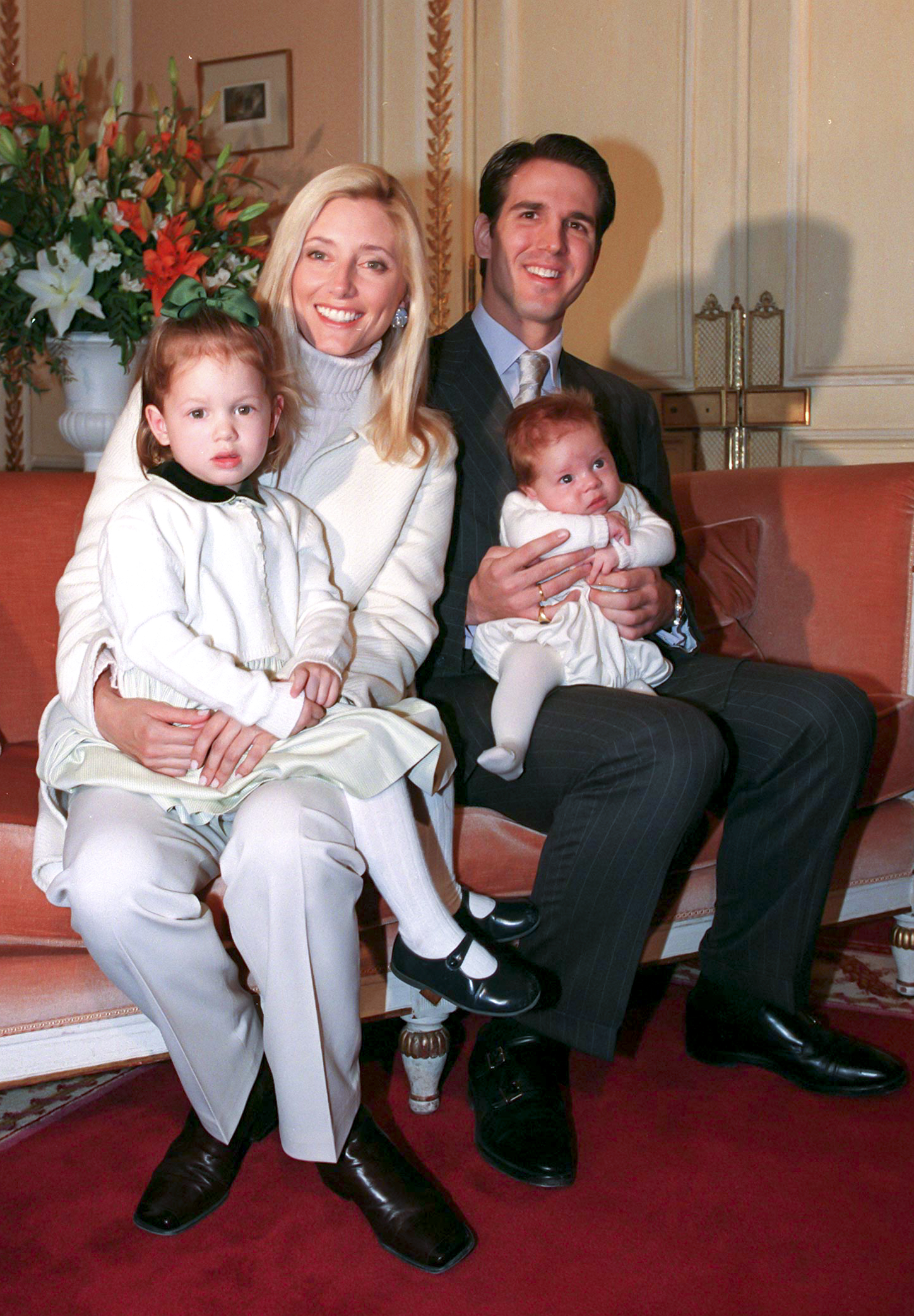 A young Princess Maria-Olympia sits on the lap of Crown Princess Marie-Chantal, as Crown Prince Pavlos holds baby Prince Constantine-Alexios during a family photocall at the Ritz Hotel in Paris. Taken on January 19, 1999, the image captures an early moment in public life for the Greek royals, just months after the little prince's birth.
