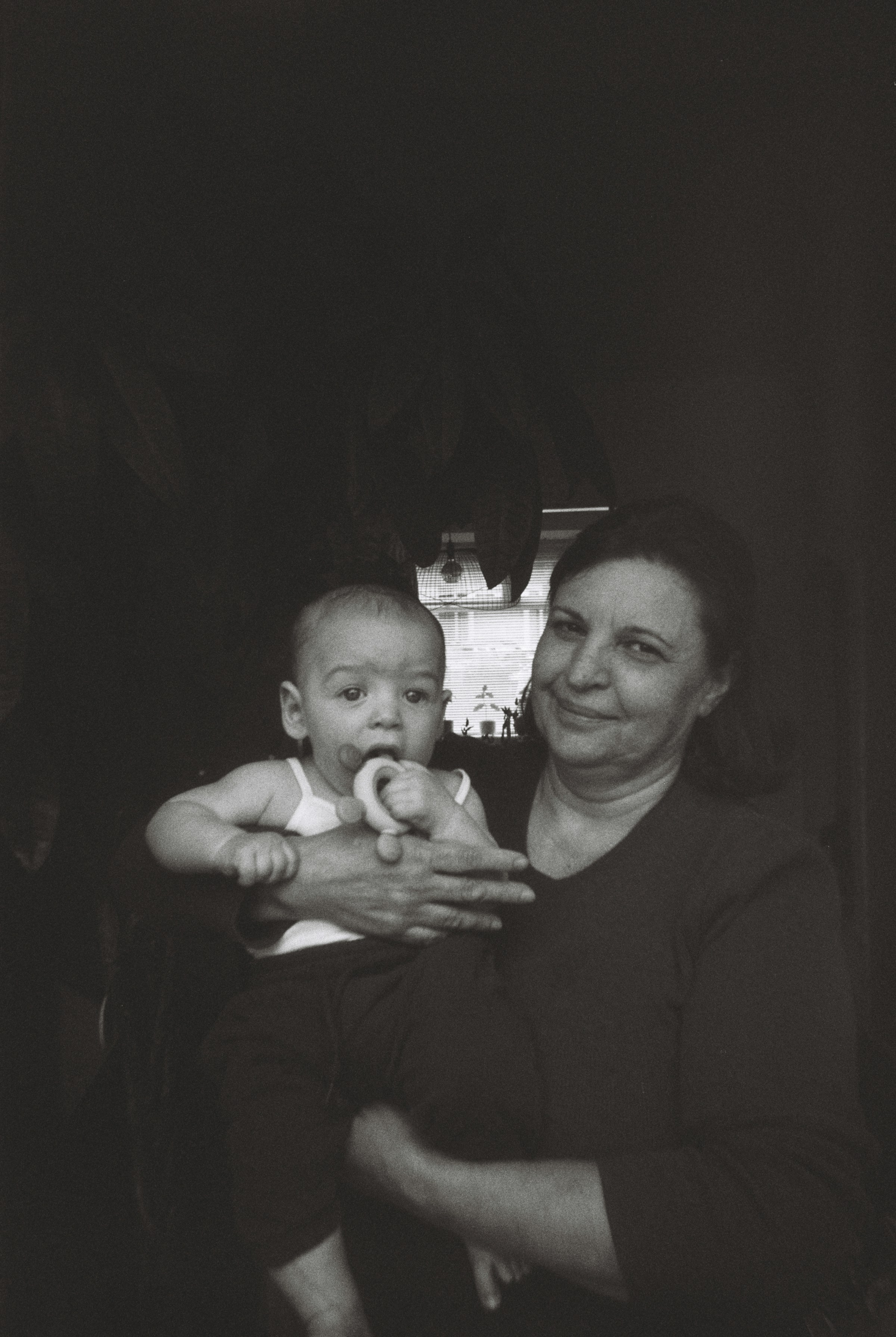 A woman holding her grandchild | Source: Unsplash