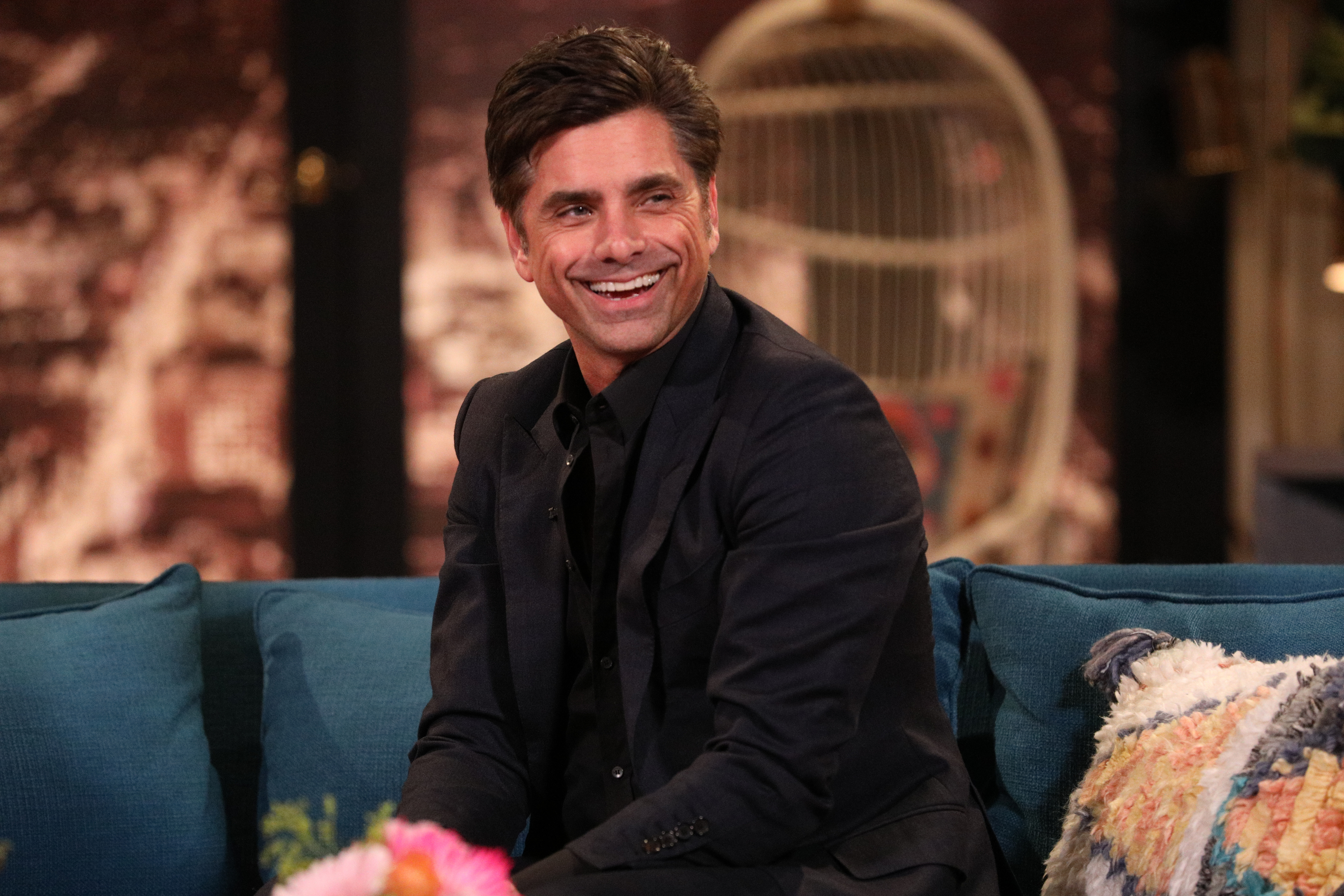 John Stamos on the set of "Busy Tonight" episode 106 | Source: Getty Images