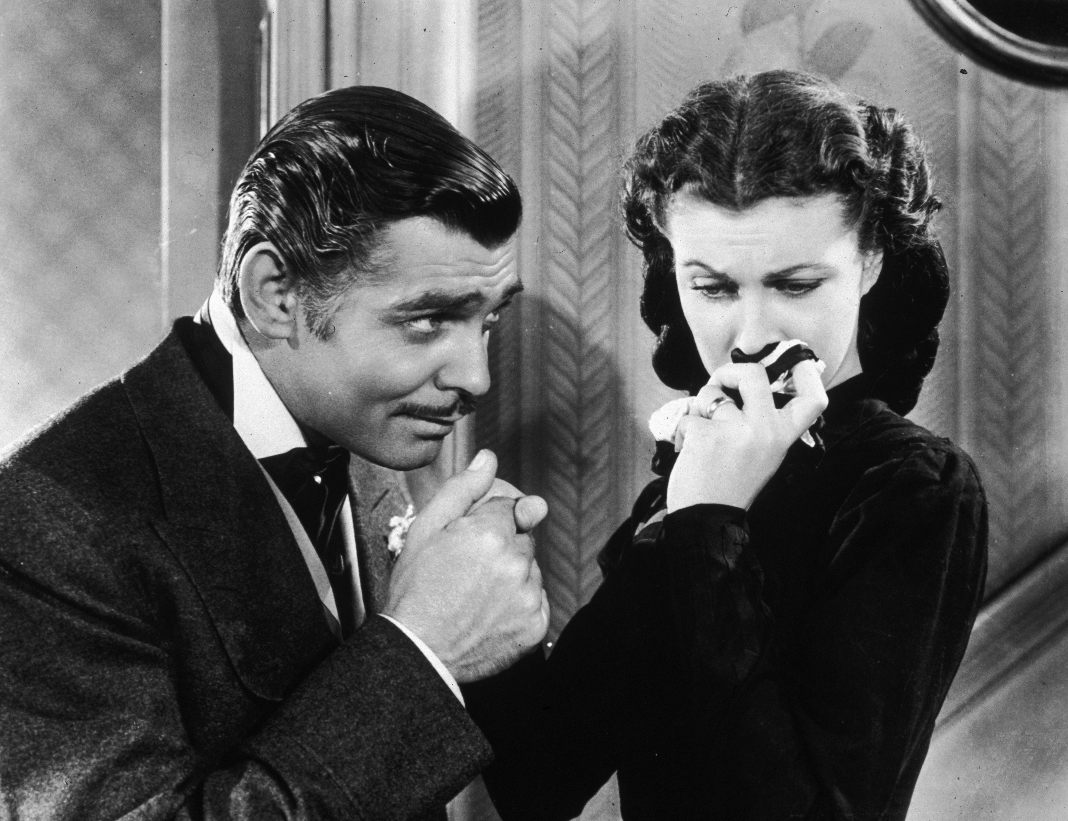 Clark Gable as Rhett Butler with  Vivien Leigh as Scarlett O'Hara in 'Gone With The Wind' | Source: Getty Images