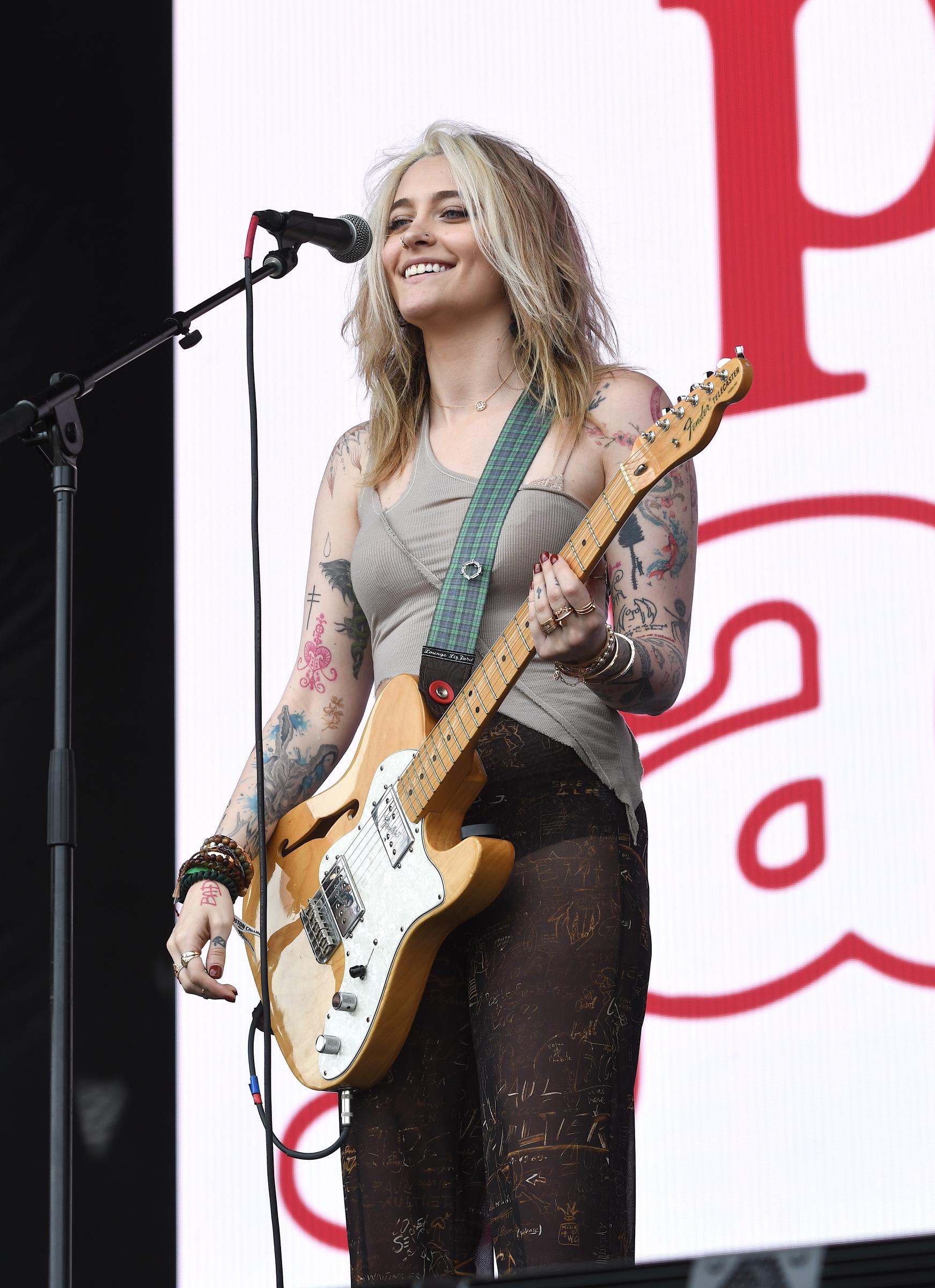 Paris Jackson is shown performing on stage during a live concert appearance on May 27, 2022 in Allston, Massachusetts. | Source: Getty Images