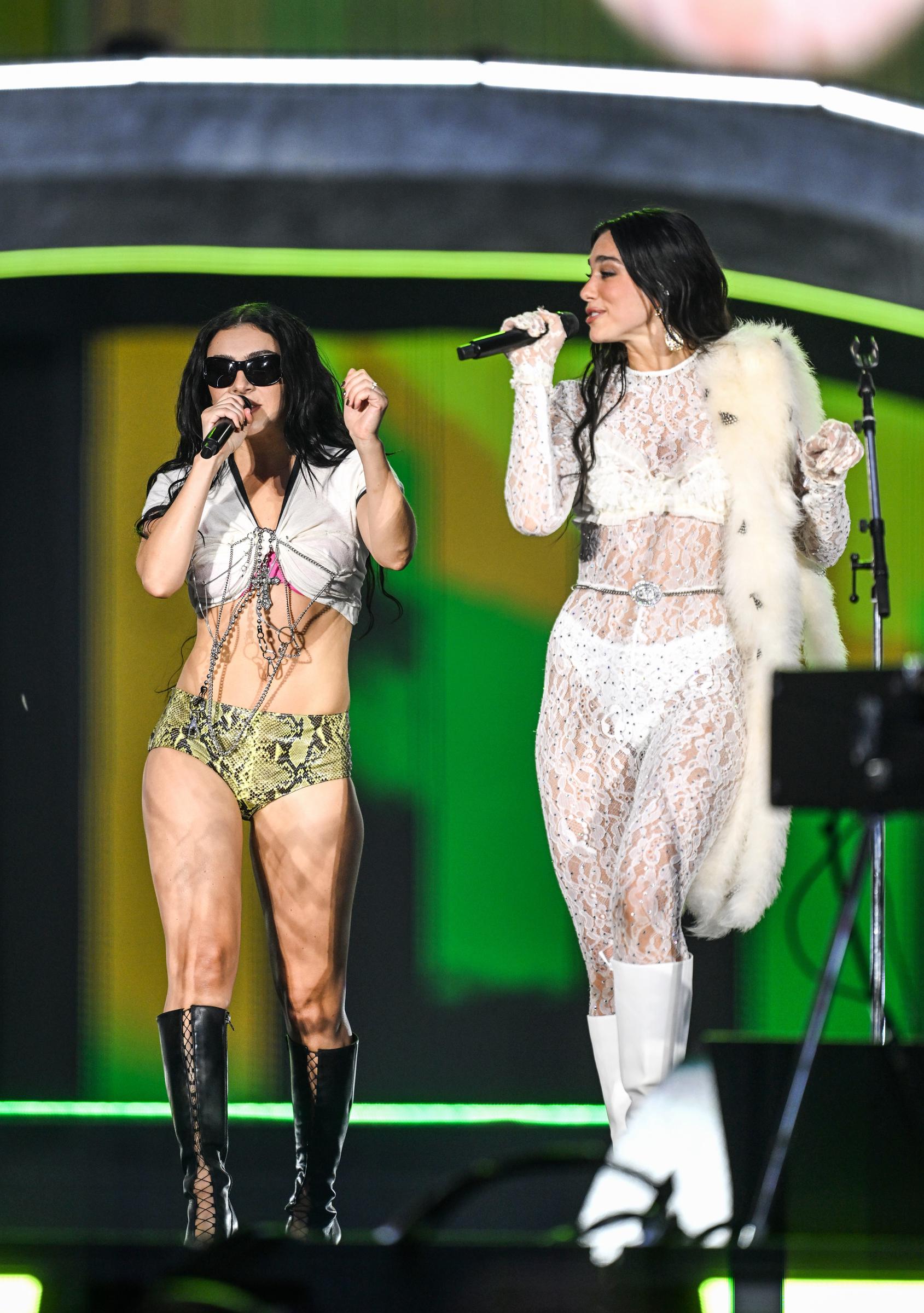 Charli XCX performs on stage with Dua Lipa during her "Radical Optimism" tour at Wembley Stadium on June 21, 2025 in London, England | Source: Getty Images