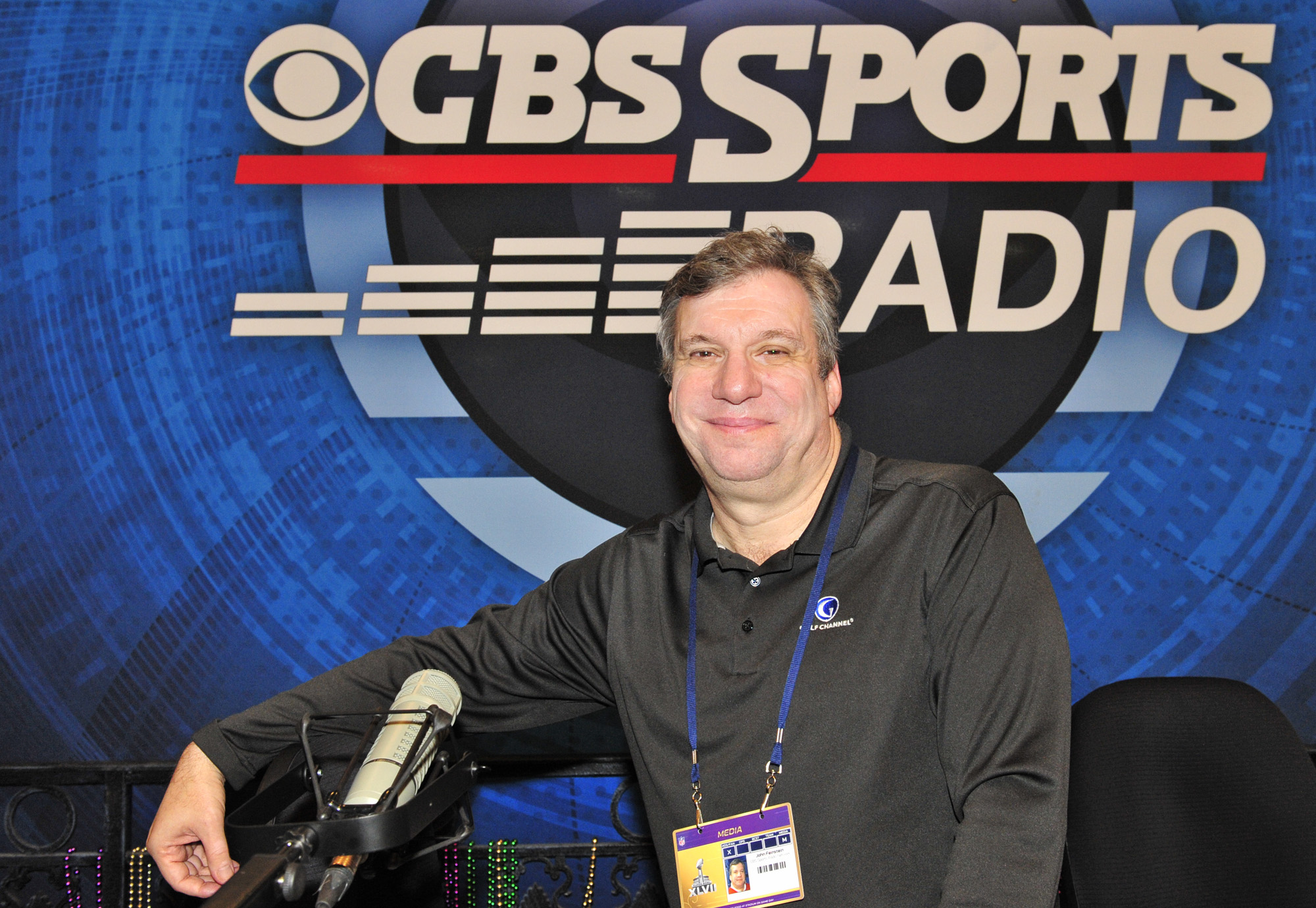 John Feinstein of the CBS SPORTS RADIO NETWORK broadcasting from Radio Row in New Orleans site of Super Bowl XLVII on January 31, 2017 | Source: Getty Images