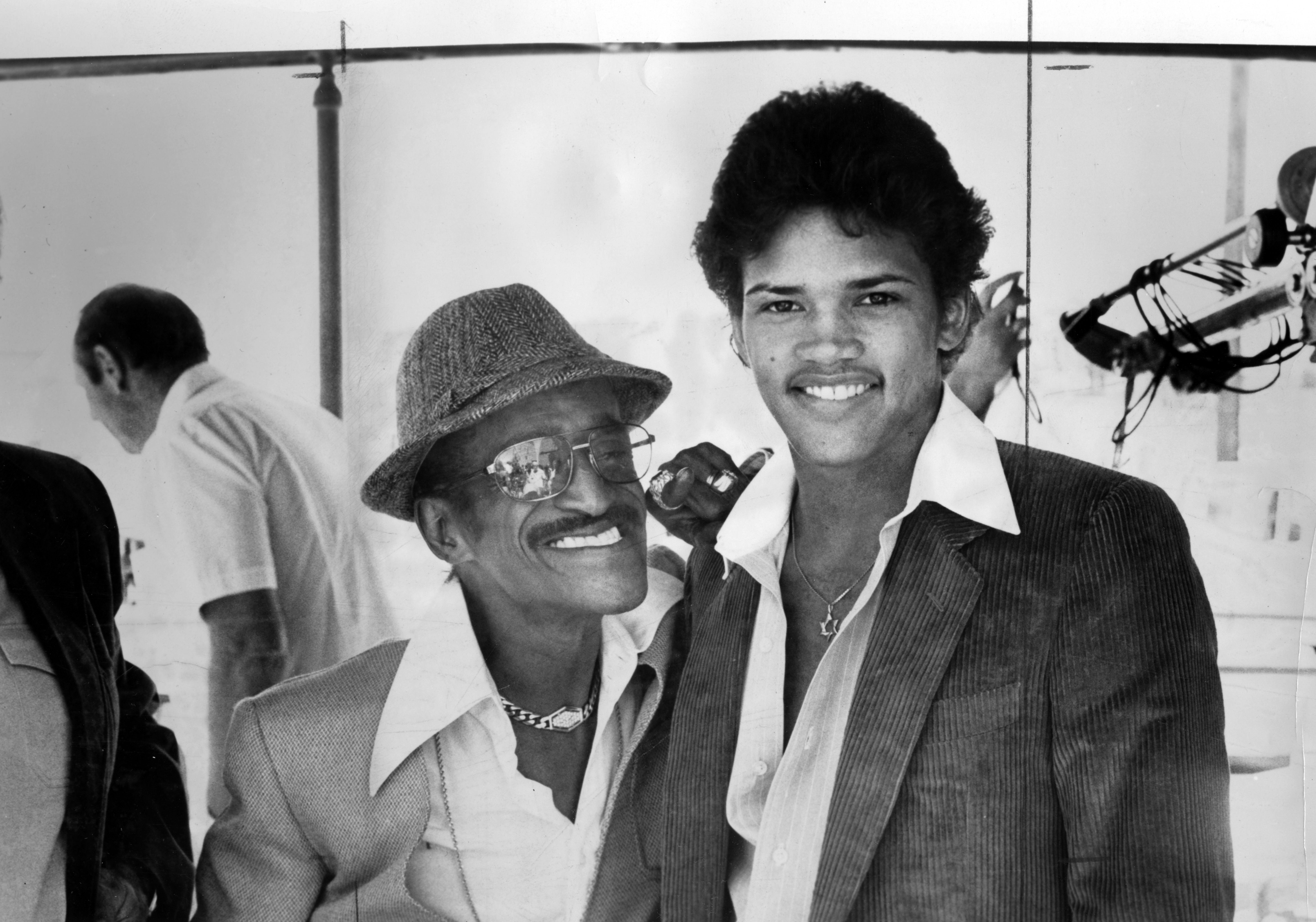 African American entertainer Sammy Davis Junior stands with his son on a movie set, 1970. | Source: Getty Images