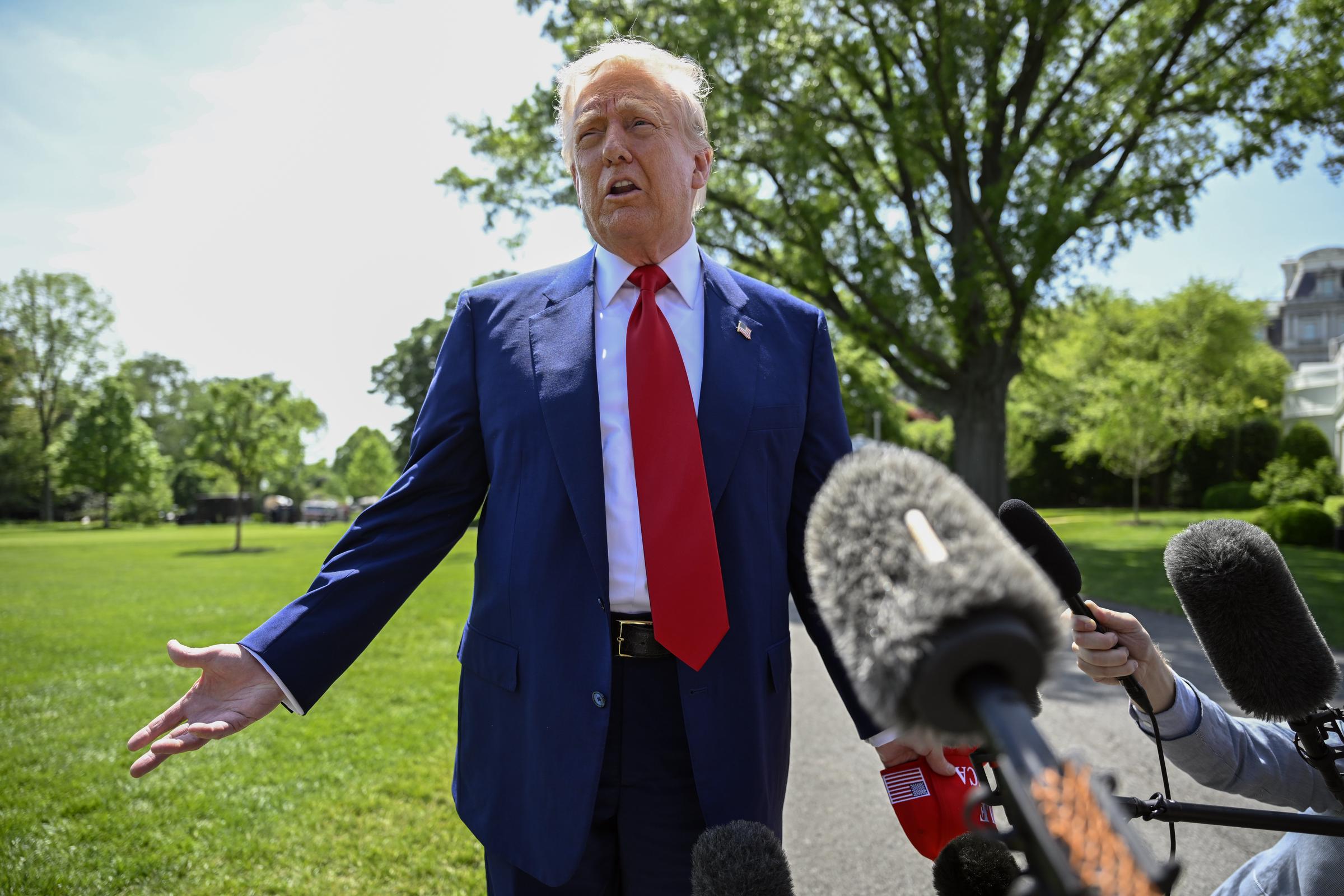 President Trump talks with reporters on the South Lawn at the White House in Washington, DC on April 29, 2025 | Source: Getty Images