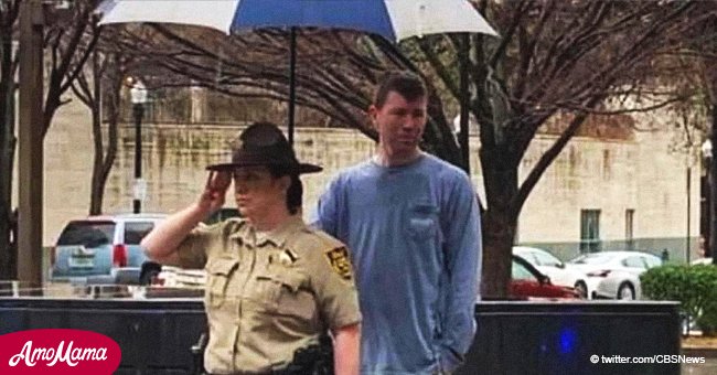 Touching moment stranger holds an umbrella for deputy honoring fallen officer in heavy rain