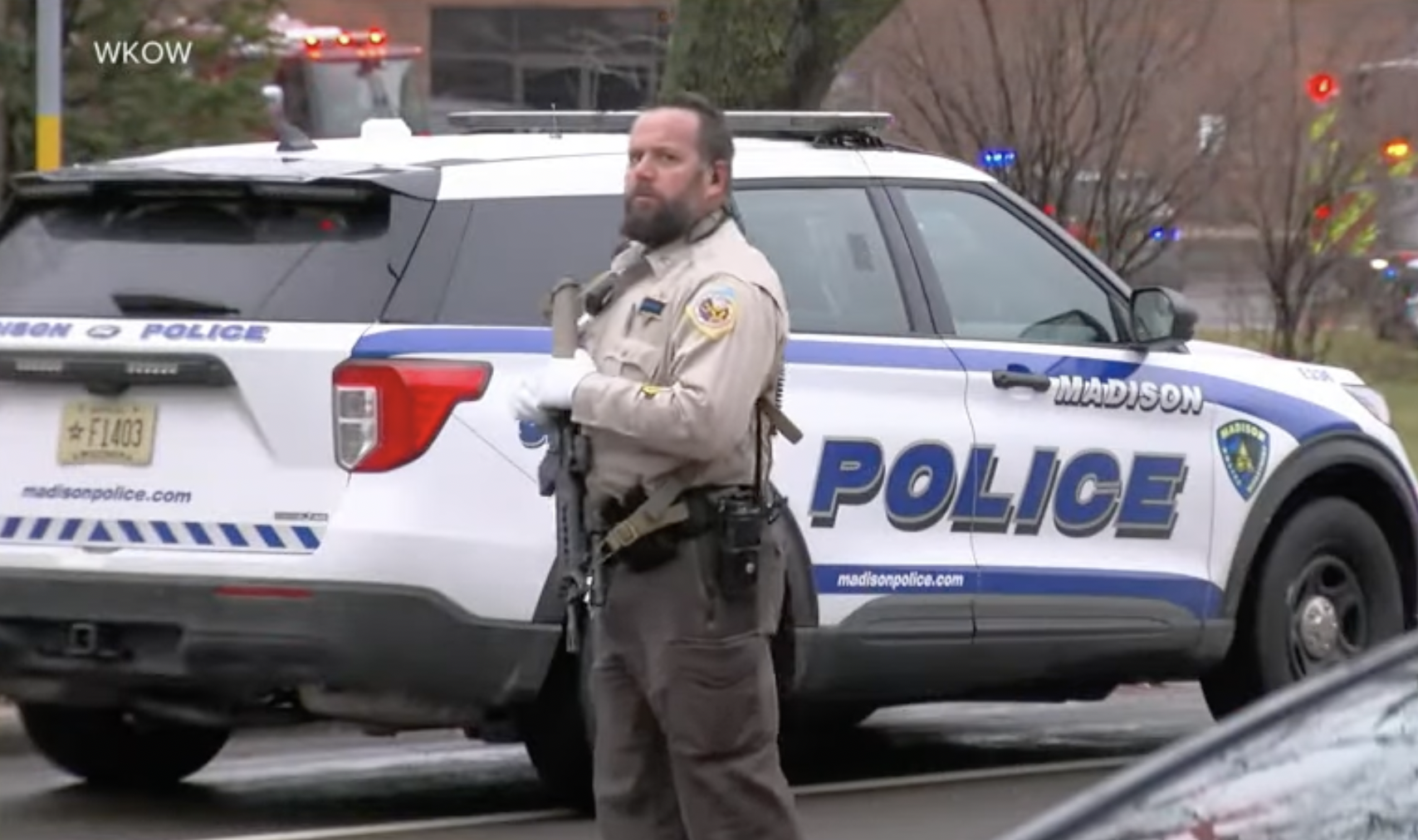 An armed police officer pictured outside the Madison Abundant Life Christian School on December 16, 2024, in Madison, Wisconsin | Source: YouTube/ABCNews