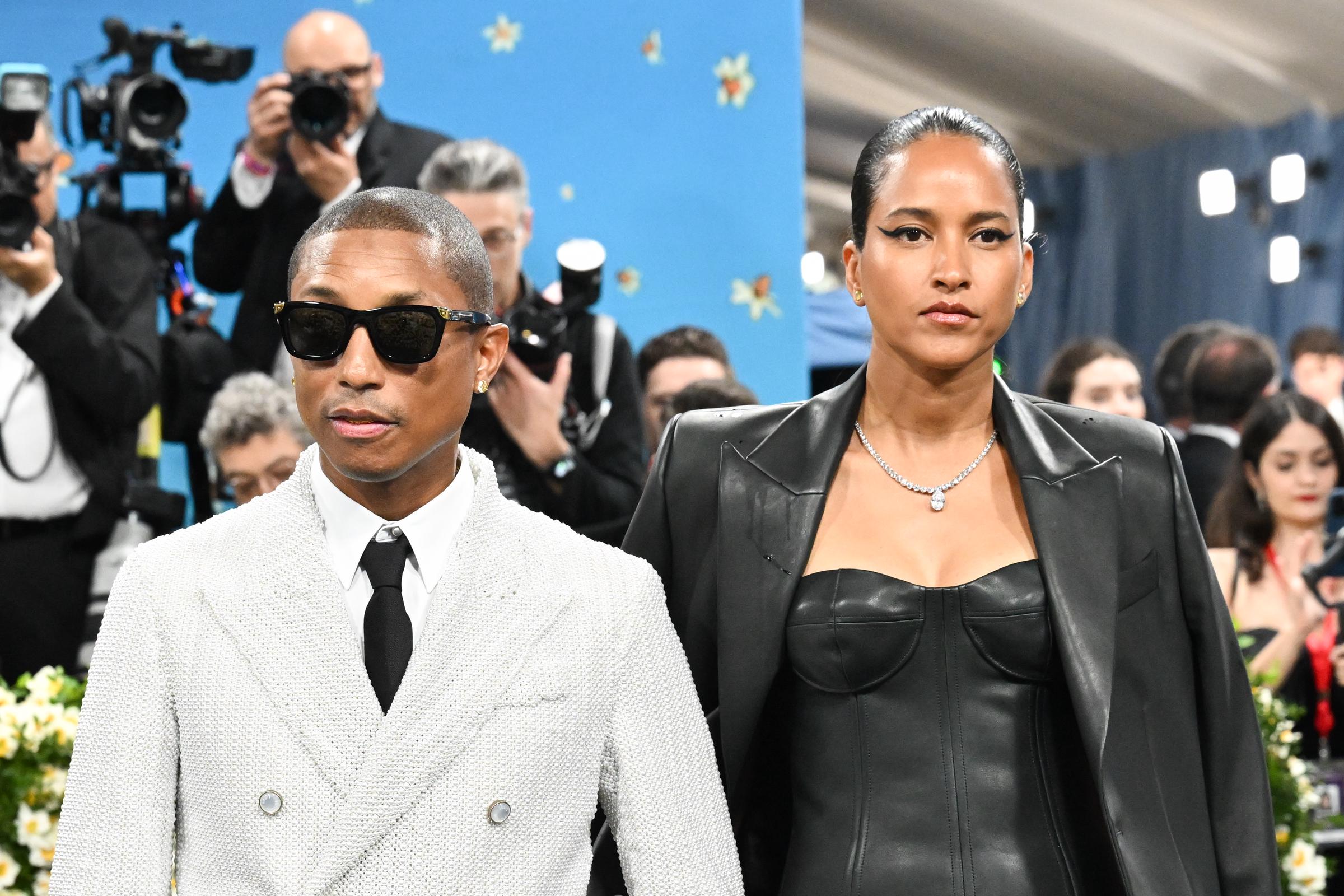 Pharrell Williams and Helen Lasichanh photographed at the Met Gala Celebrating "Superfine: Tailoring Black Style" on May 5, 2025, in New York City. | Source: Getty Images