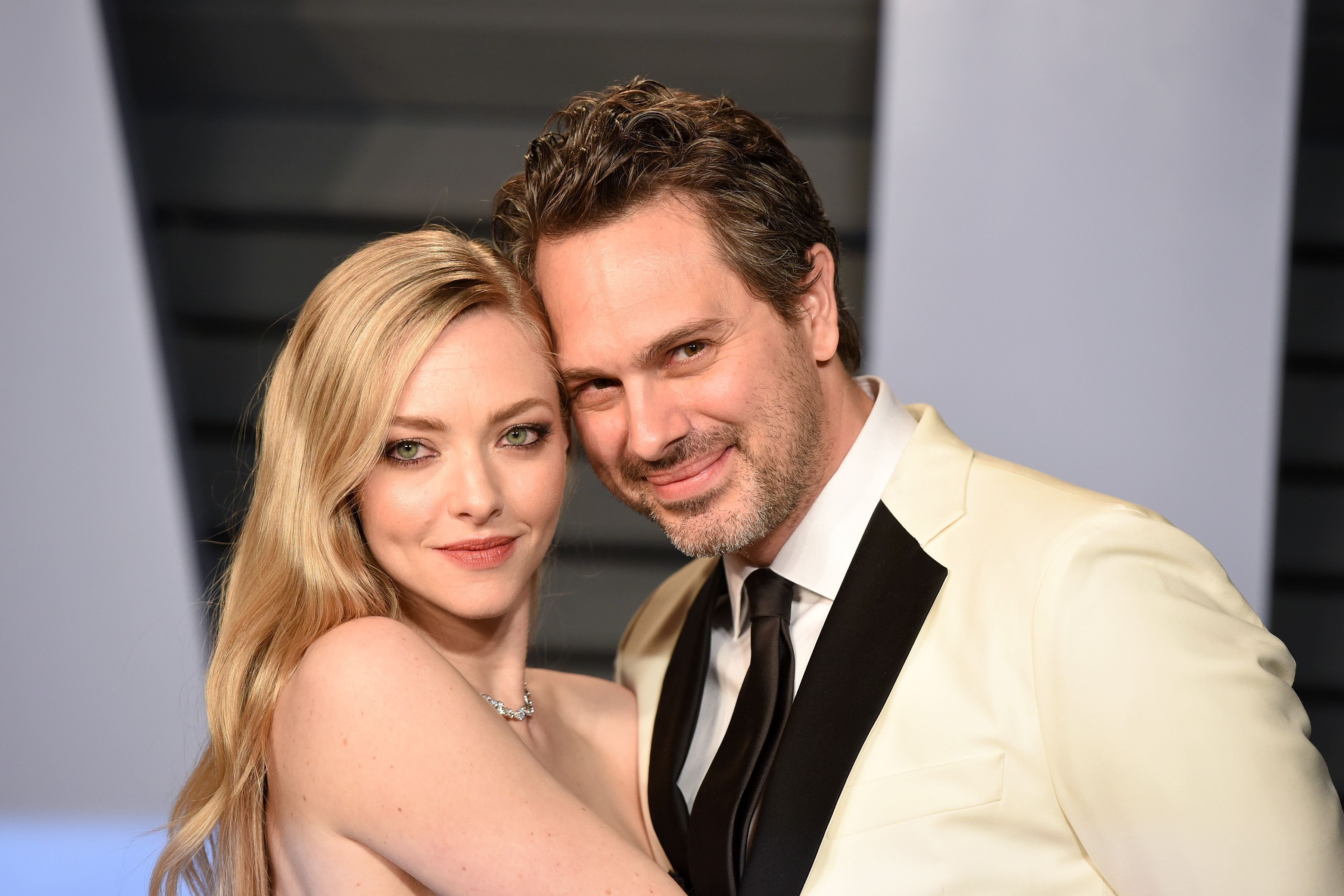 Amanda Seyfried and Thomas Sadoski during the 2018 Vanity Fair Oscar Party Hosted By Radhika Jones - Arrivals at Wallis Annenberg Center for the Performing Arts on March 4, 2018 in Beverly Hills, CA. | Source: Getty Images