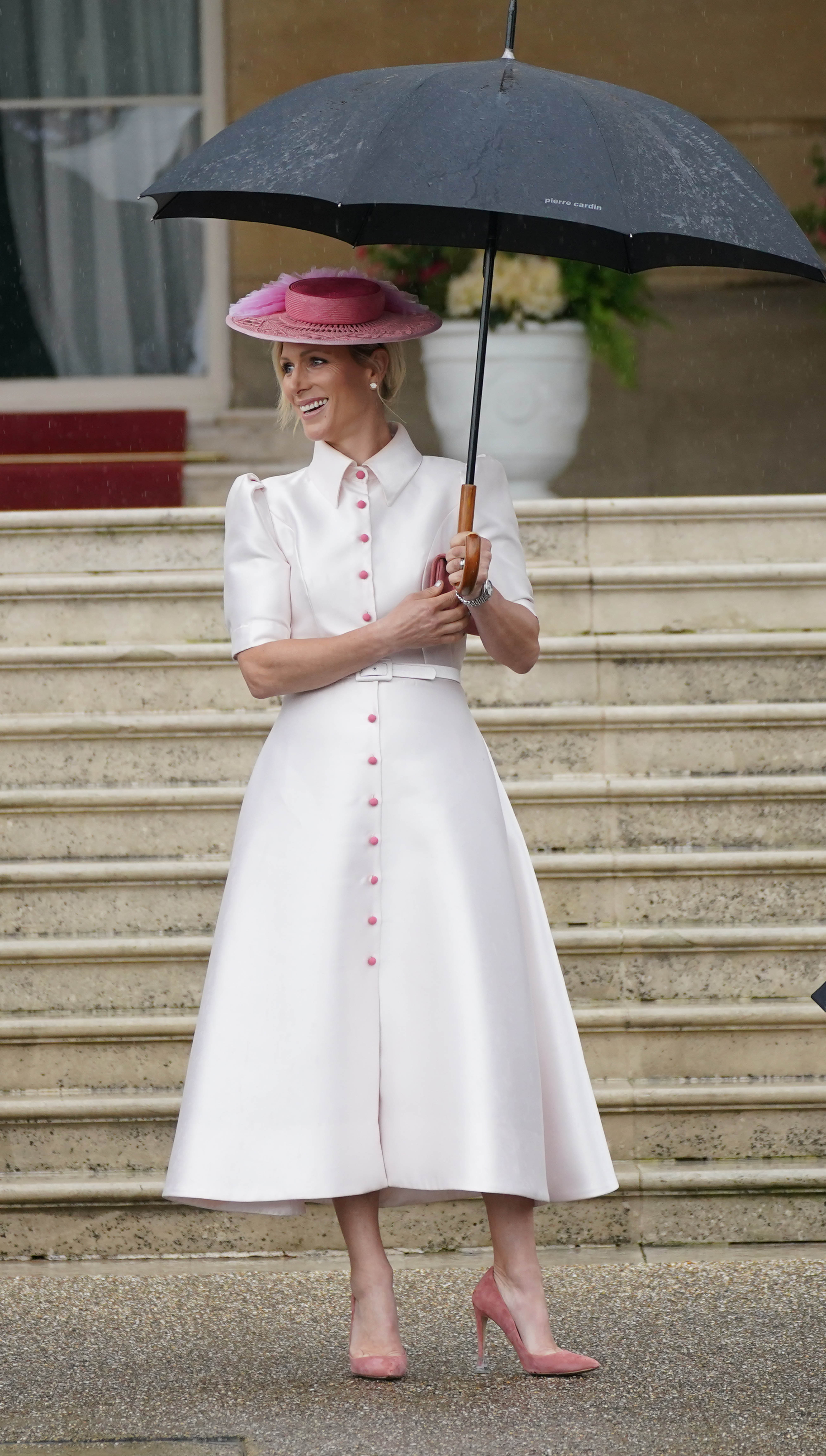 Zara Tindall carries an umbrella at the Sovereign's Garden Party on May 21, 2024, in London, England. | Source: Getty Images