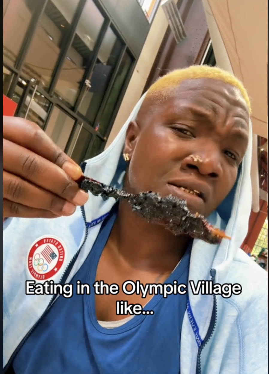 A screenshot of Raven Saunders holding some kind of skewer at the Olympic Village dining hall | Source: TikTok/giveme1shot