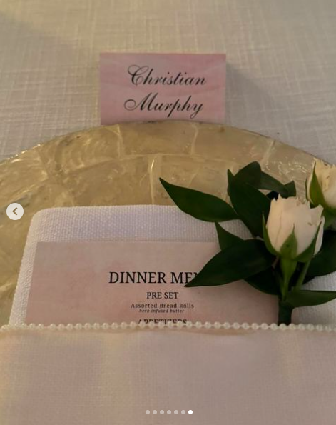 A photo of Christian Murphy's name card and dinner menu, posted on July 12, 2024 | Source: Instagram/theybf_daily