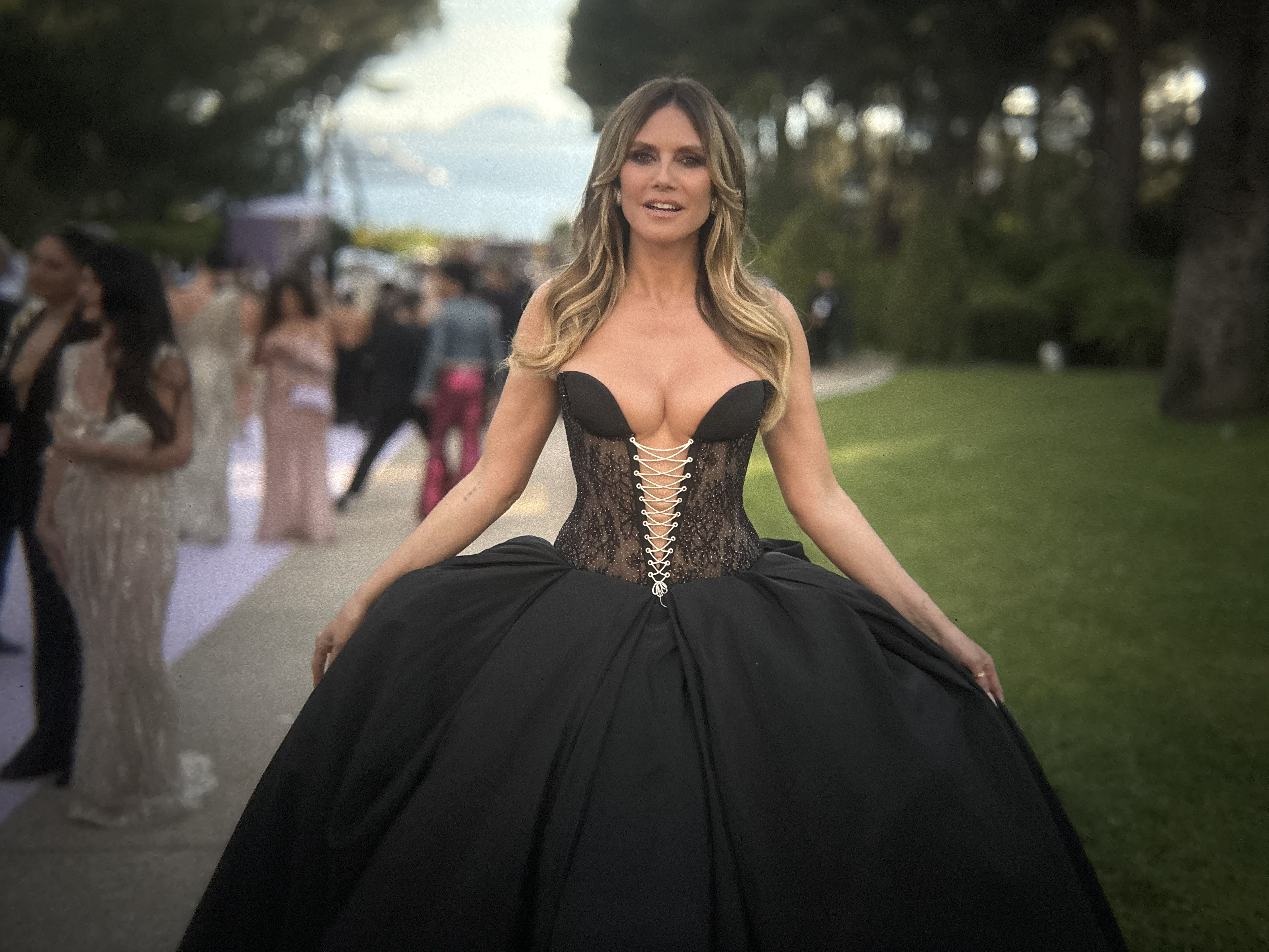 Heidi Klum commands attention in a dramatic corseted gown, embracing the figure she says has naturally changed with age and weight gain. | Source: Getty Images