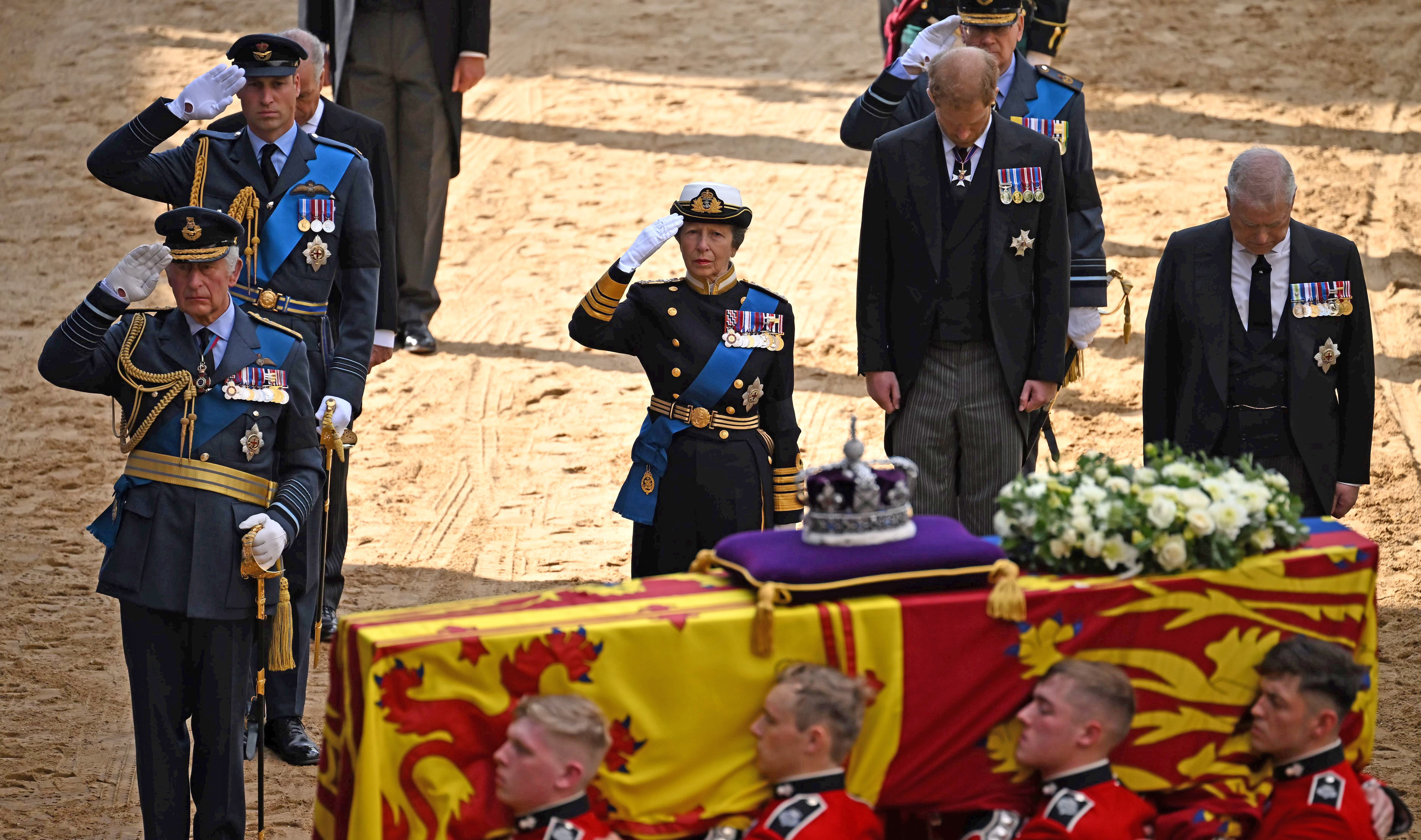 King Charles III, Prince William, Princess Anne, Prince Harry, and Prince Andrew follow the coffin of Queen Elizabeth II, adorned with a Royal Standard and the Imperial State Crown, arrives at the Palace of Westminster on September 14, 2022 in London, United Kingdom | Source: Getty Images