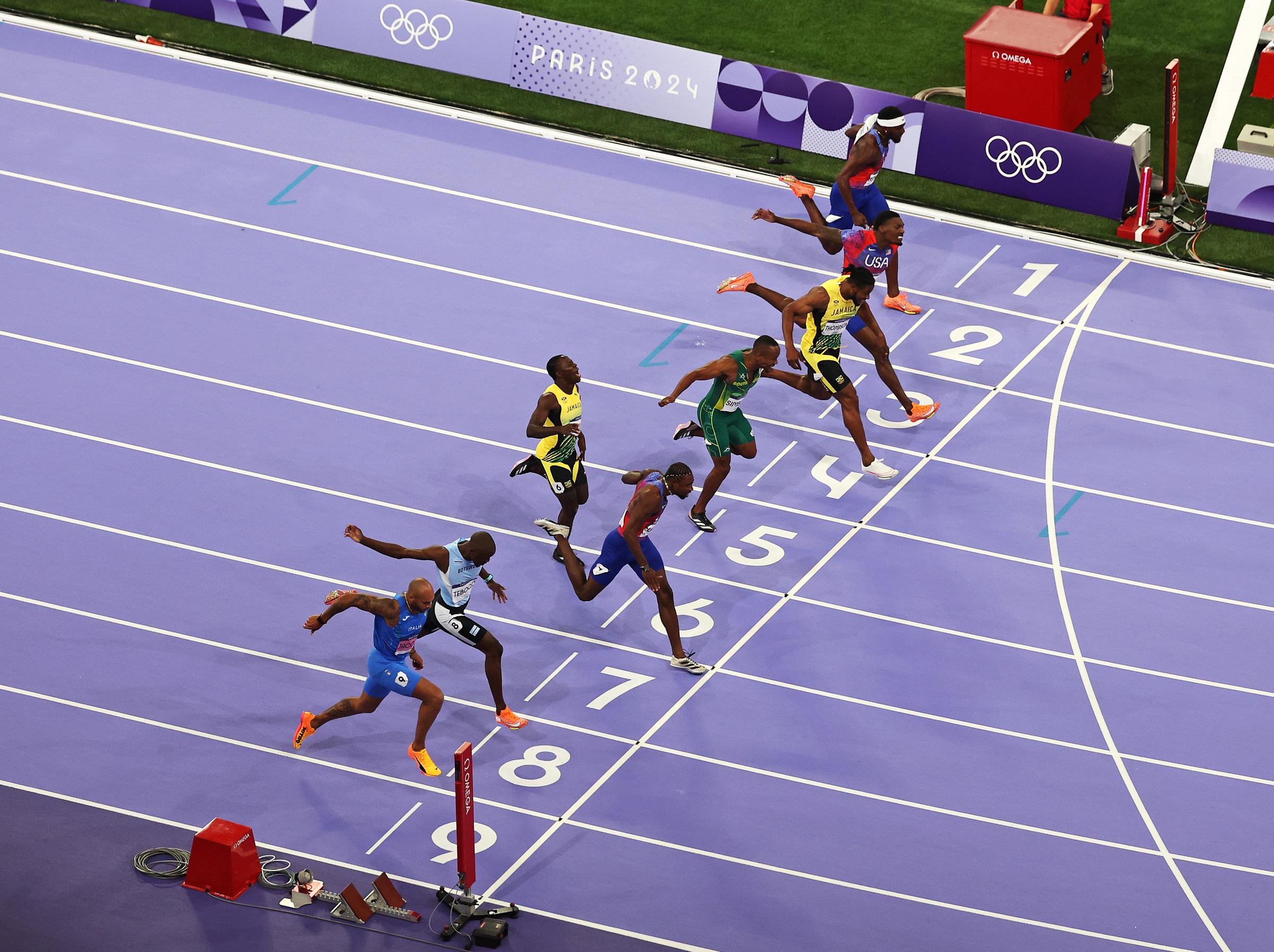 An aerial view as Noah Lyles crosses the finish line winning the gold medal in the Men's 100m Final at the Olympic Games Paris 2024 in Paris, France, on August 4, 2024. | Source: Getty Images