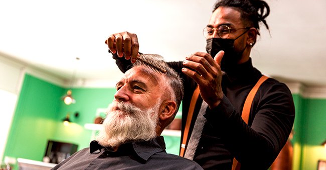 A photo of a barber giving a haircut. | Photo: Shutterstock