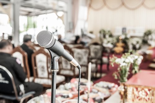 A close up of a microphone for speeches during a funeral. | Source: Shutterstock.
