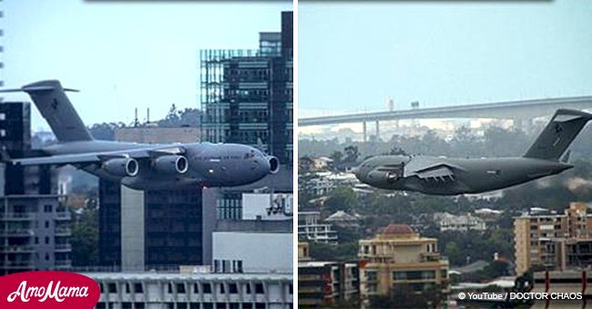 Scary moment when huge plane flies between buildings is caught on camera