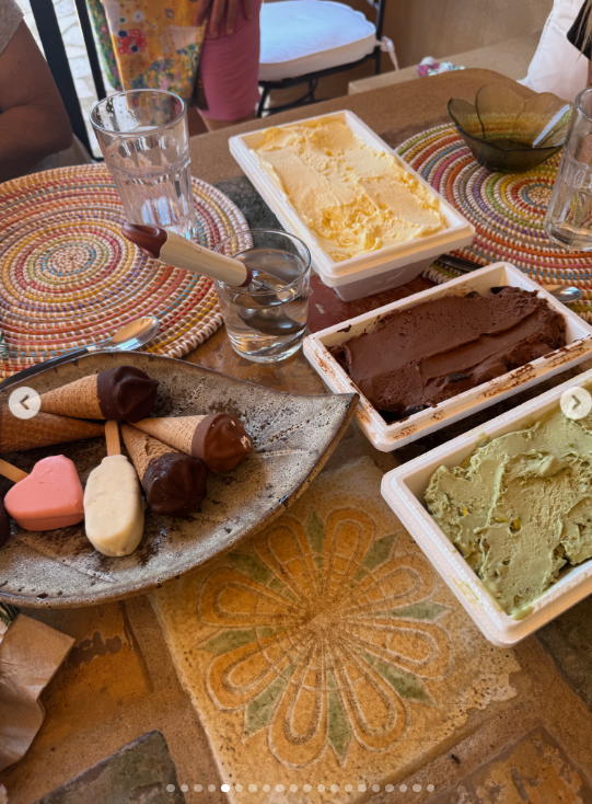 Ice cream tubs, chocolate-dipped cones and other frozen treats covered the table in another image from the trip. The food photo shows that Hudson's post documented everyday family stops as closely as it did the beach scenes. | Source: Instagram/katehudson