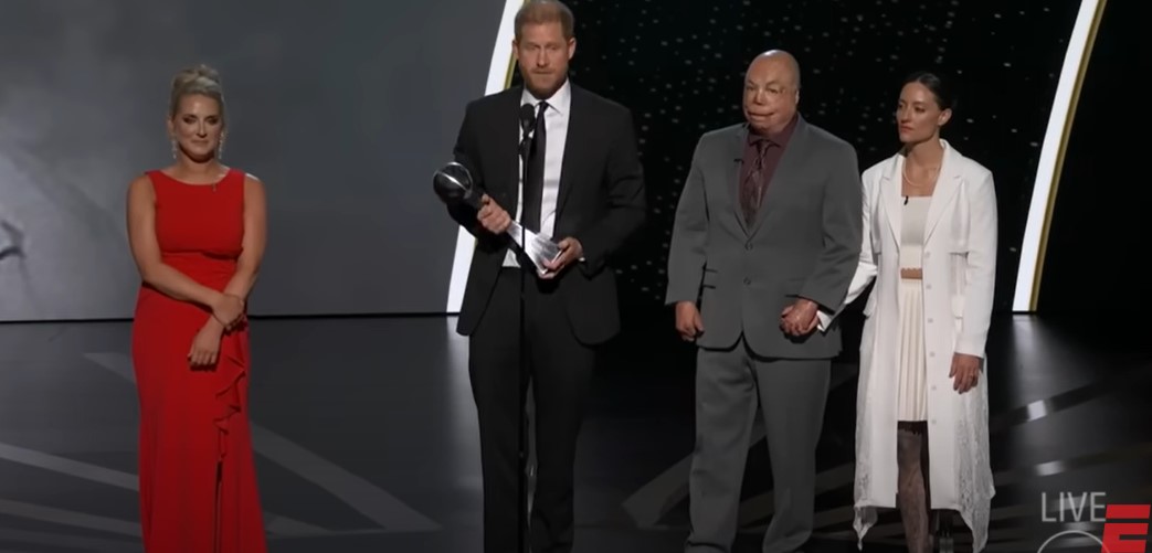 Prince Harry giving a speech at the ESPY Awards stage with the presenters who announced his Pat Tillman Award for Service on July 11, 2024, in Hollywood, California | Source: YouTube/ESPN