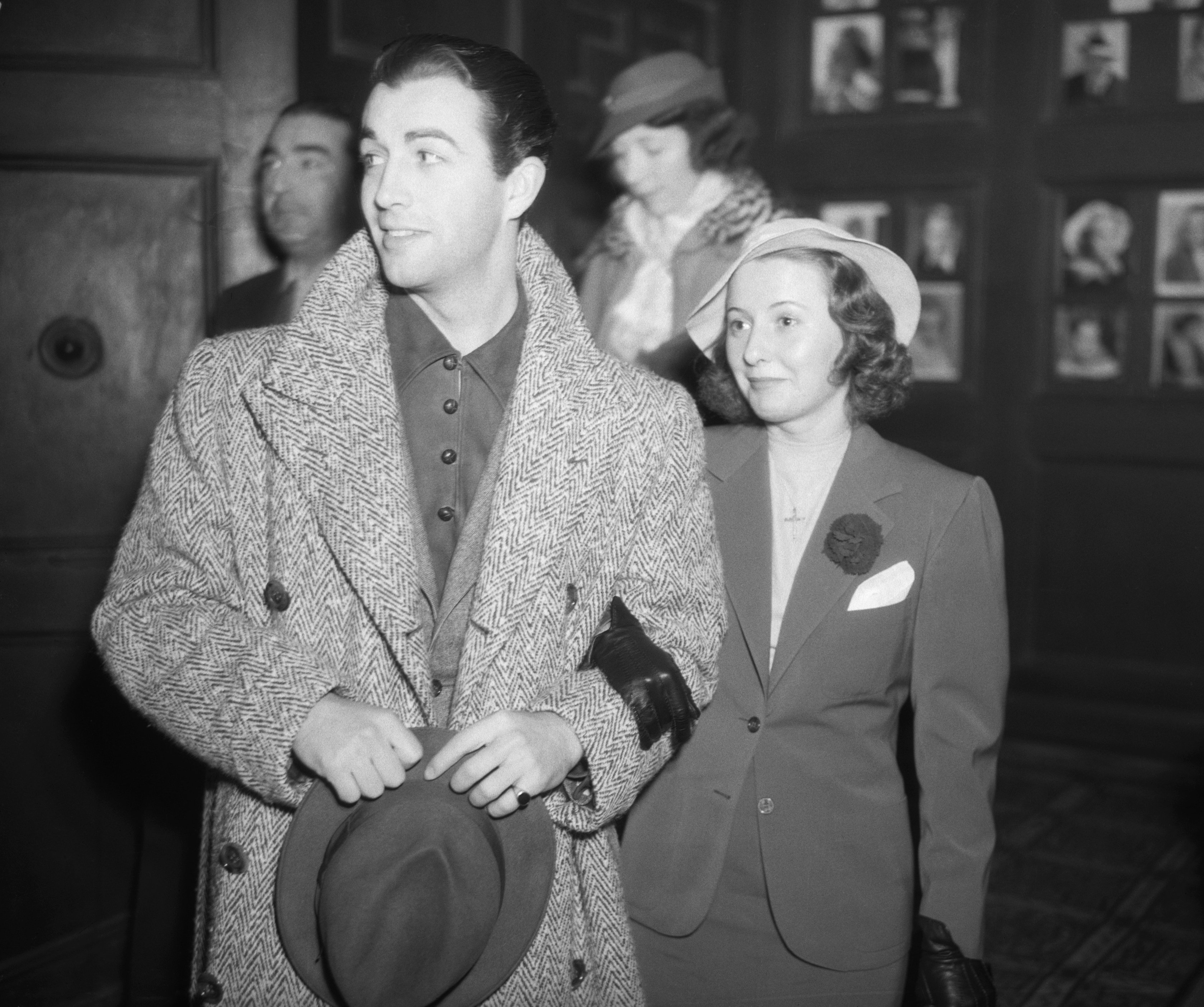 Robert Taylor and Barbara Stanwyck are pictured as they arrive at a preview of the "Country Doctor" on an unspecified date in Los Angeles | Source: Getty Images