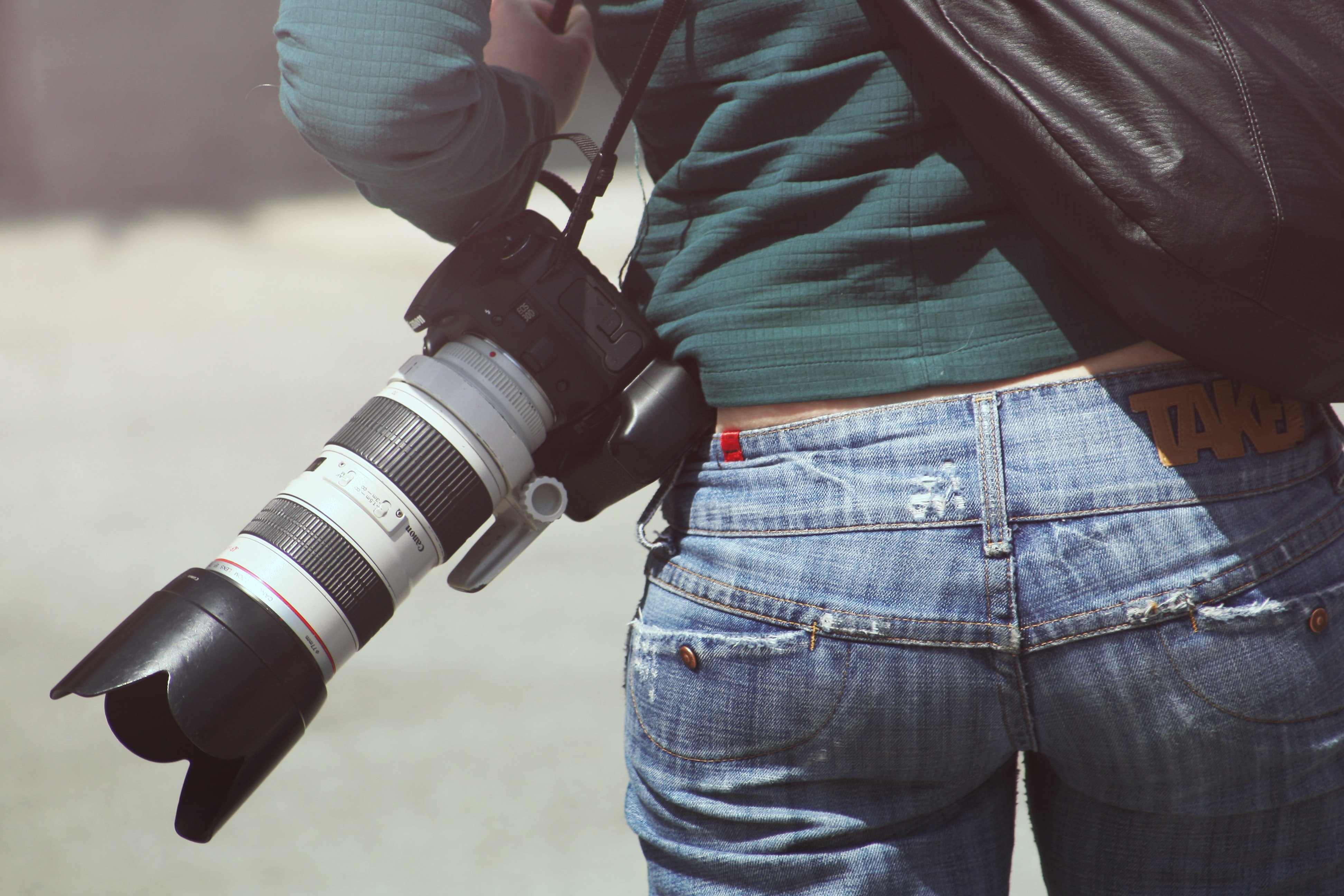 A journalist on field with their camera : Photo: Pexels