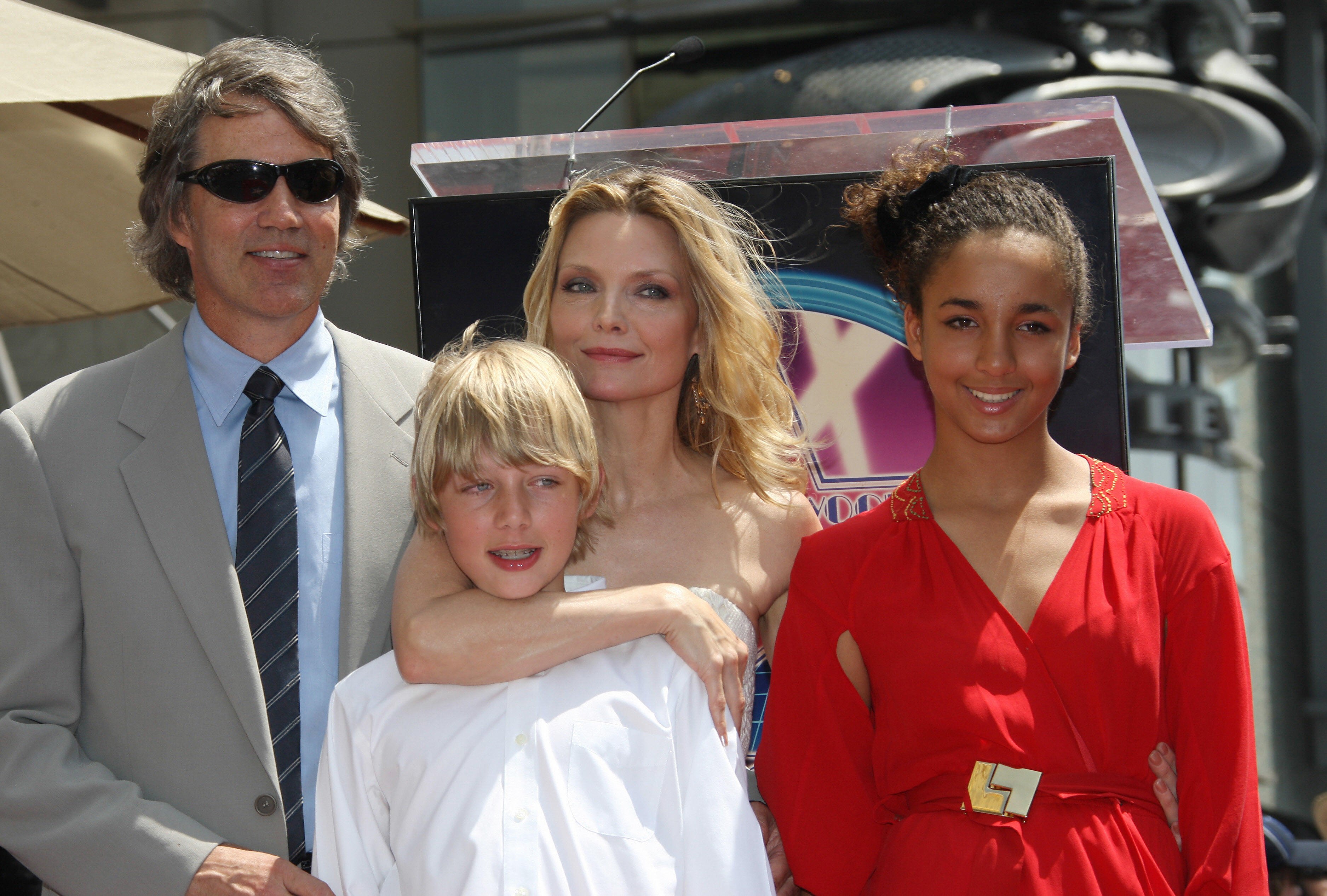 US actress Michelle Pfeiffer poses with her daughter Claudia (R), her son John (C) and her husband David E. Kelley during the presentation ceremony 06 August 2007, in Hollywood, California | Source: Getty Images