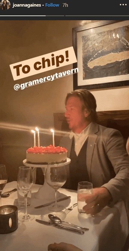 Chip Gaines smiles in front of a red berry topped cheese cake for his 45th birthday dinner celebration | Source: Instagram.com/joannagaines