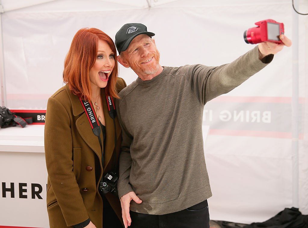  Bryce Dallas Howard, with filmmaker Ron Howard, hosts the Canon Let It Snow Globe spectacle at Hollywood & Highland | Getty Images
