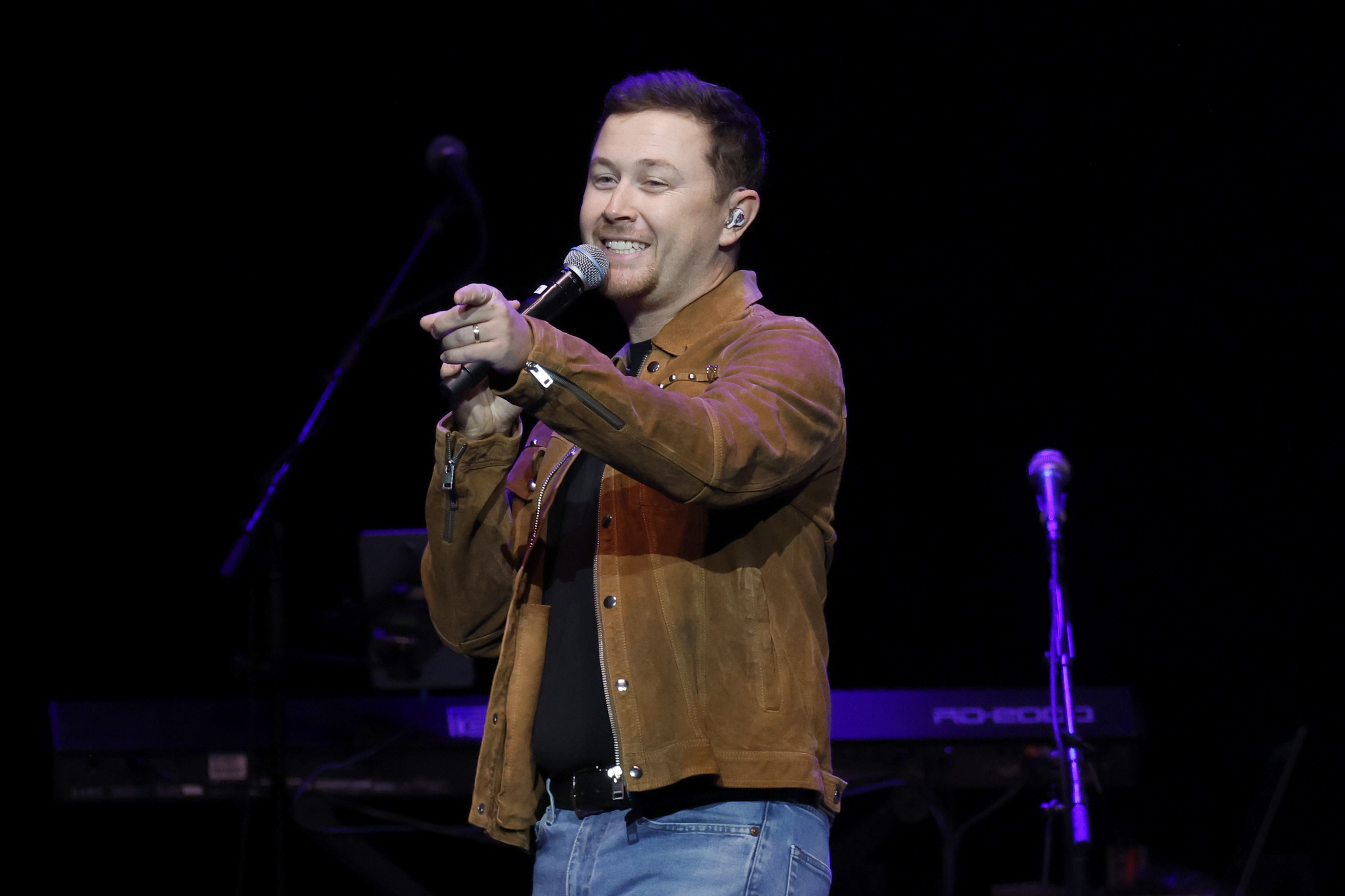 Scotty McCreery performing during Ronnie Milsap's final Nashville show at Bridgestone Arena on October 3, 2023, in Tennessee. | Source: Getty Images