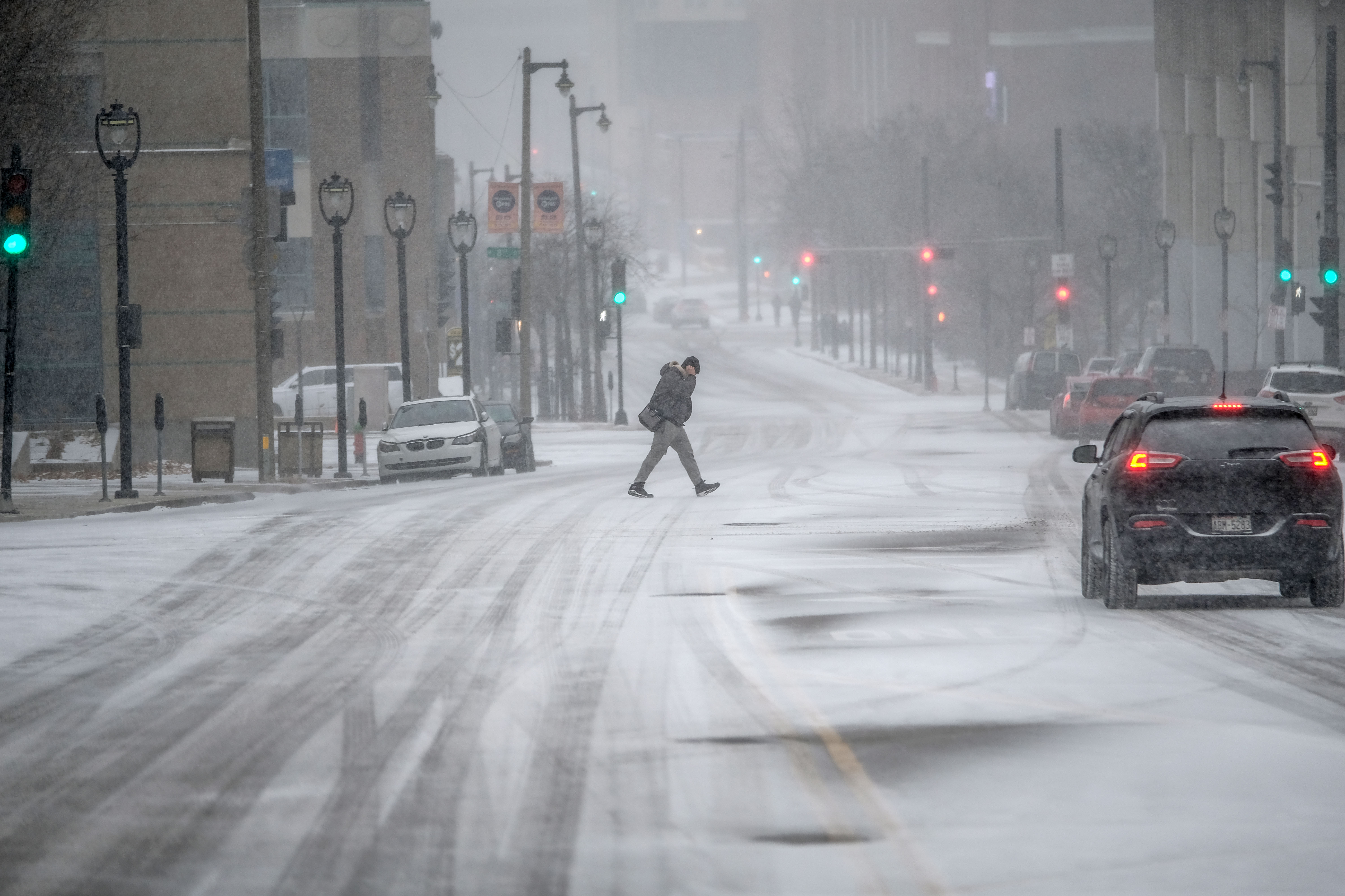 Pedestrian walks in cold weather in Wisconsin on December 22, 2022 | Source: Getty Images