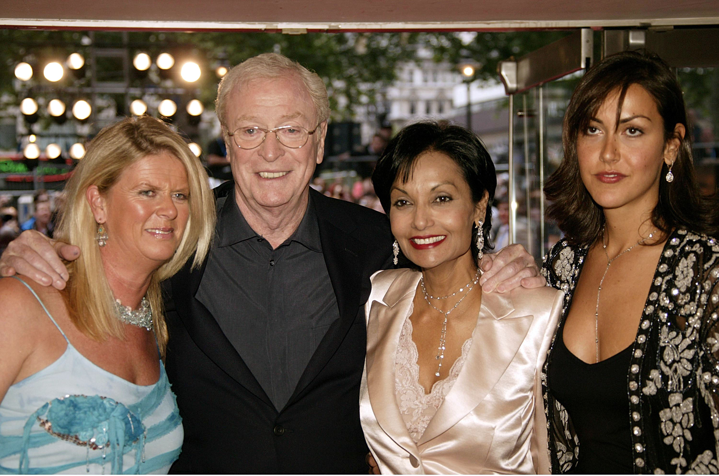 (L-R) Dominique Caine, Michael Caine, Shakira Caine, and Natasha Caine arrive at the European premiere of "Batman Begins" at the Odeon Leicester Square on June 12, 2005, in London, England. | Source: Getty Images