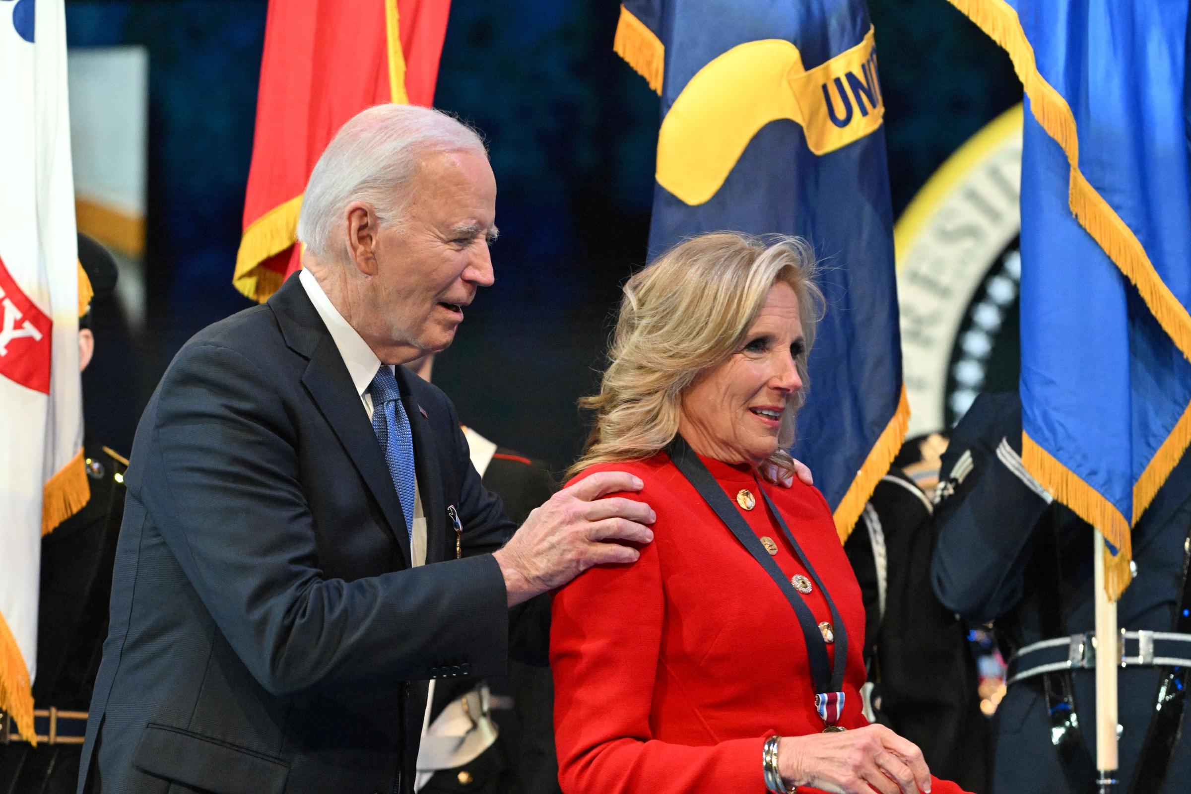 Joe Biden embraces Jill Biden after she received a medal for distinguished public service at a Department of Defense Commander in Chief Farewell Ceremony at Joint Base Myers-Henderson Hall in Arlington, Virginia, on January 16, 2025 | Source: Getty Images