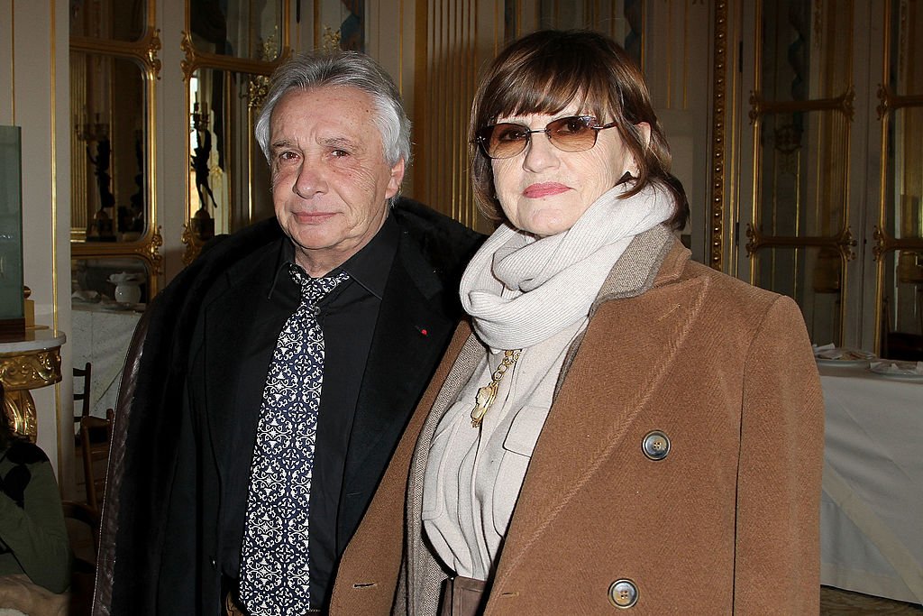 Michel Sardou et Anne-Marie Périer le 8 février 2012 à Paris. l Source : Getty Images