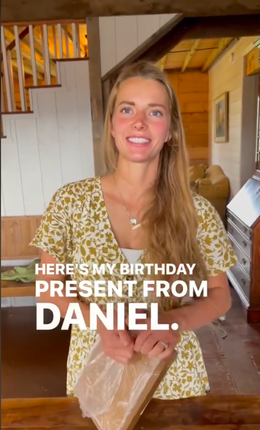 Hannah Neeleman opening a birthday gift from Daniel Neeleman, posted on July 5, 2024 | Source: TikTok/hannal.ballerinafarm