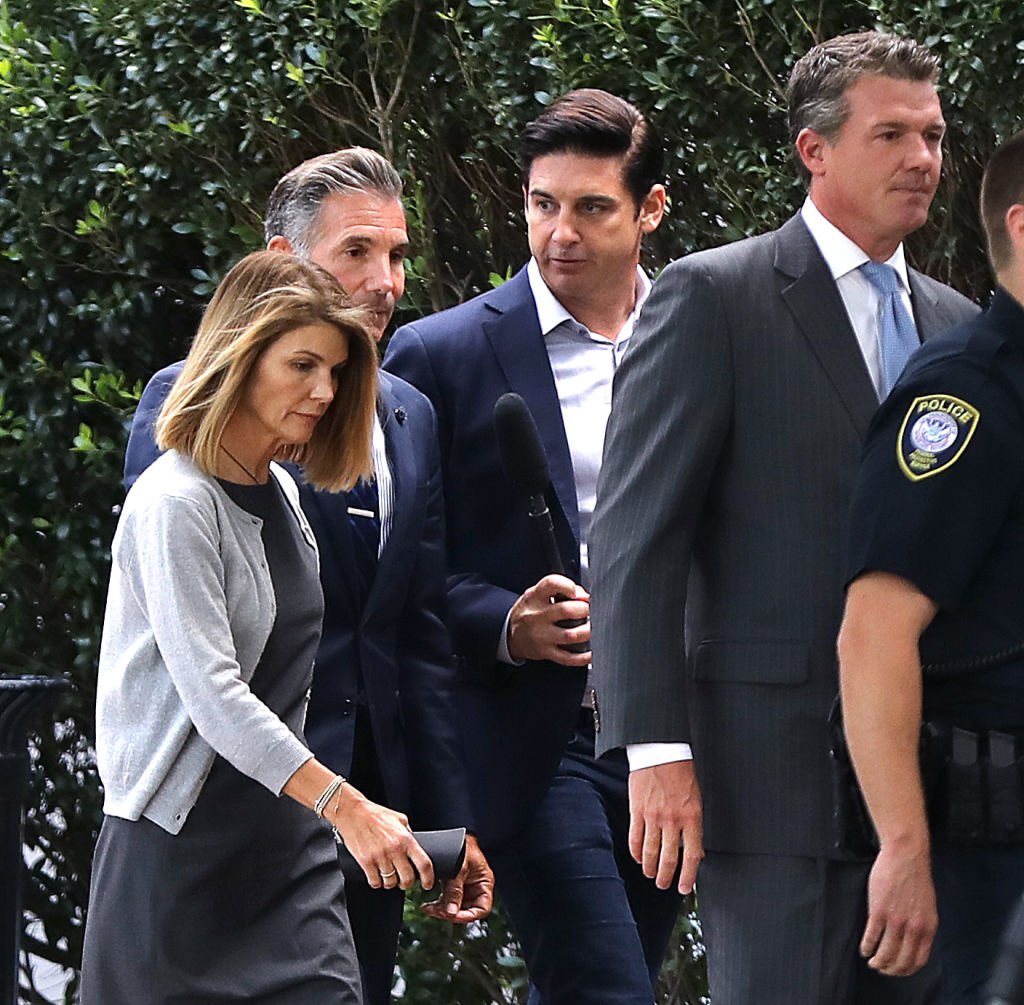 Lori Loughlin, far left, and her husband Mossimo Giannulli, second from left, leave the John Joseph Moakley United States Courthouse in Boston | Photo: Getty Images