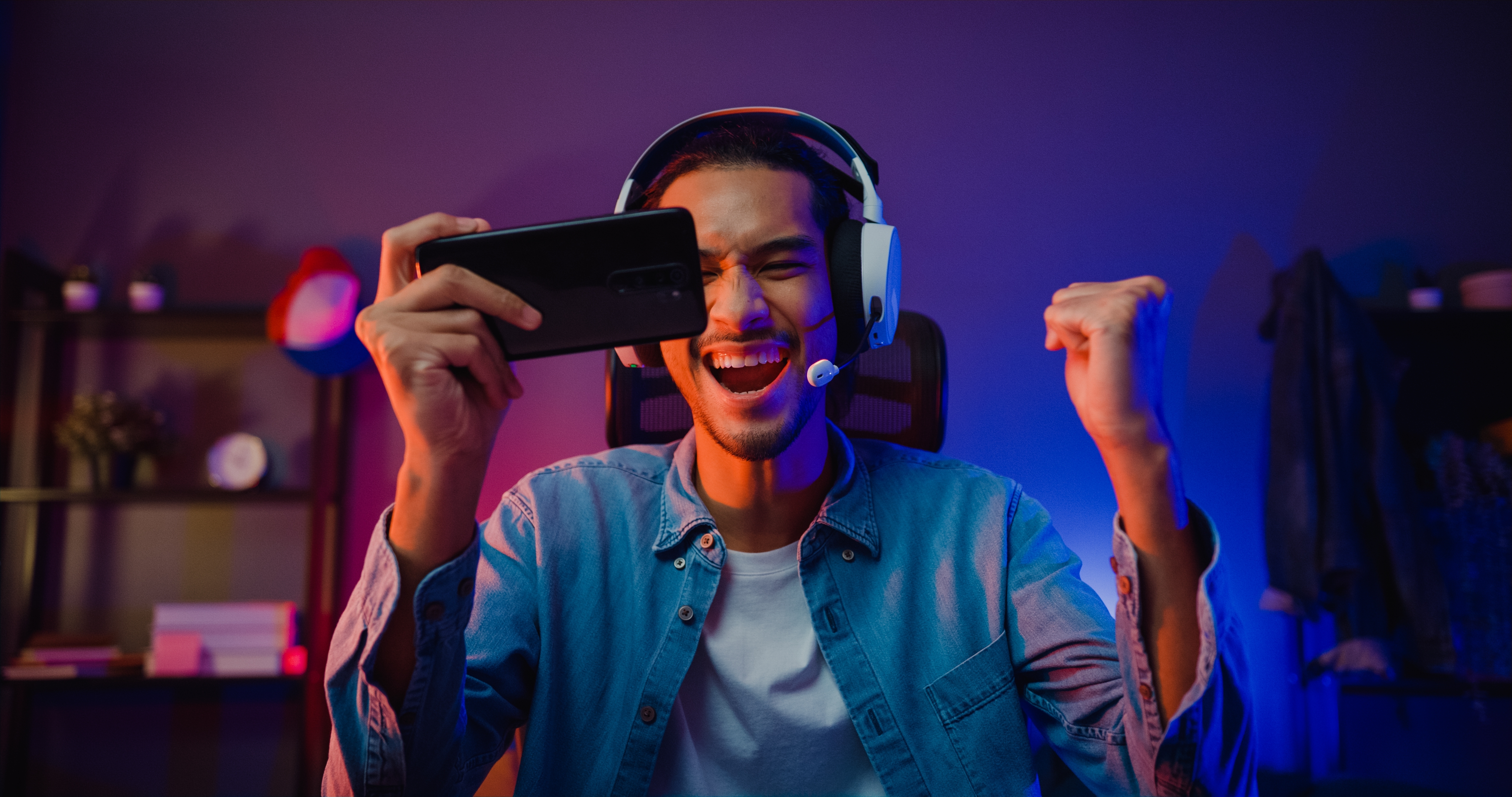 A happy man playing an online game | Source: Shutterstock