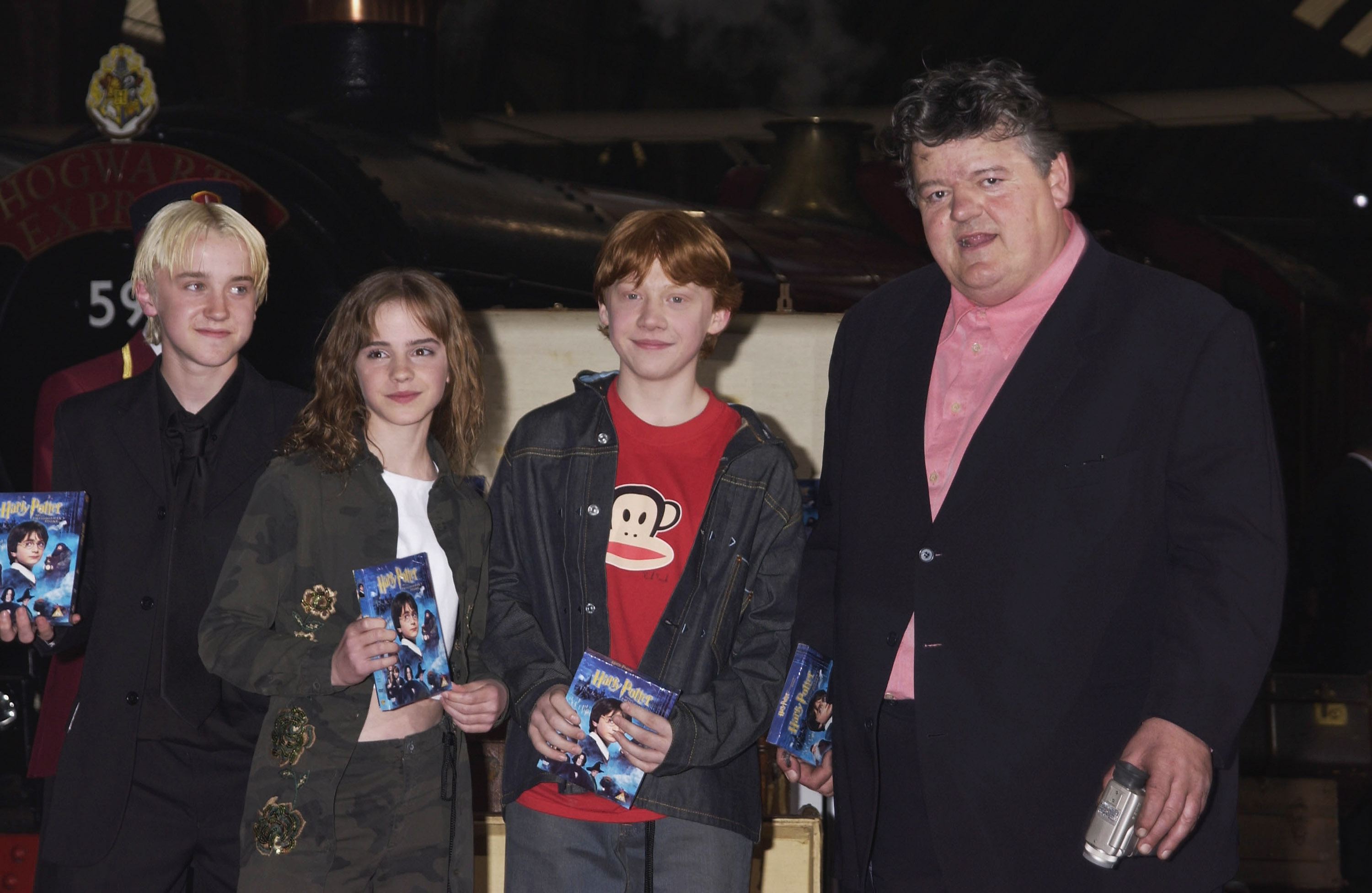 The actor, Emma Watson, Rupert Grint, and Robbie Coltrane at the "Harry Potter and The Philosopher's Stone" DVD launch party on May 8, 2002, in London, England. | Source: Getty Images