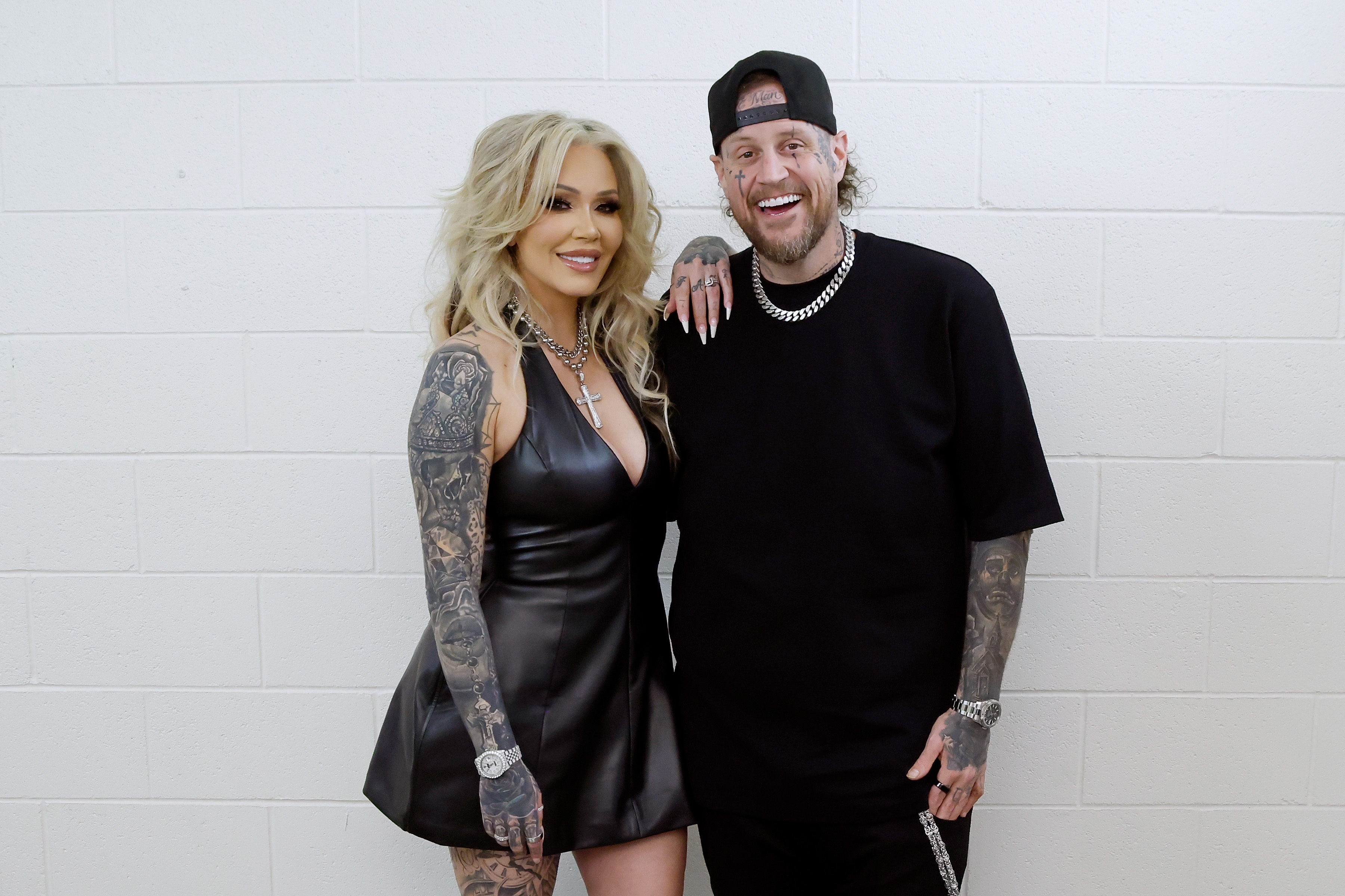 Bunnie XO and Jelly Roll pose together backstage, smiling for the camera with their arms around each other. Bunnie later revealed that after telling him to "file the [expletive] divorce papers" during a Mother's Day argument, she left and did not speak to him for weeks before he ultimately filed for divorce. | Source: Getty Images