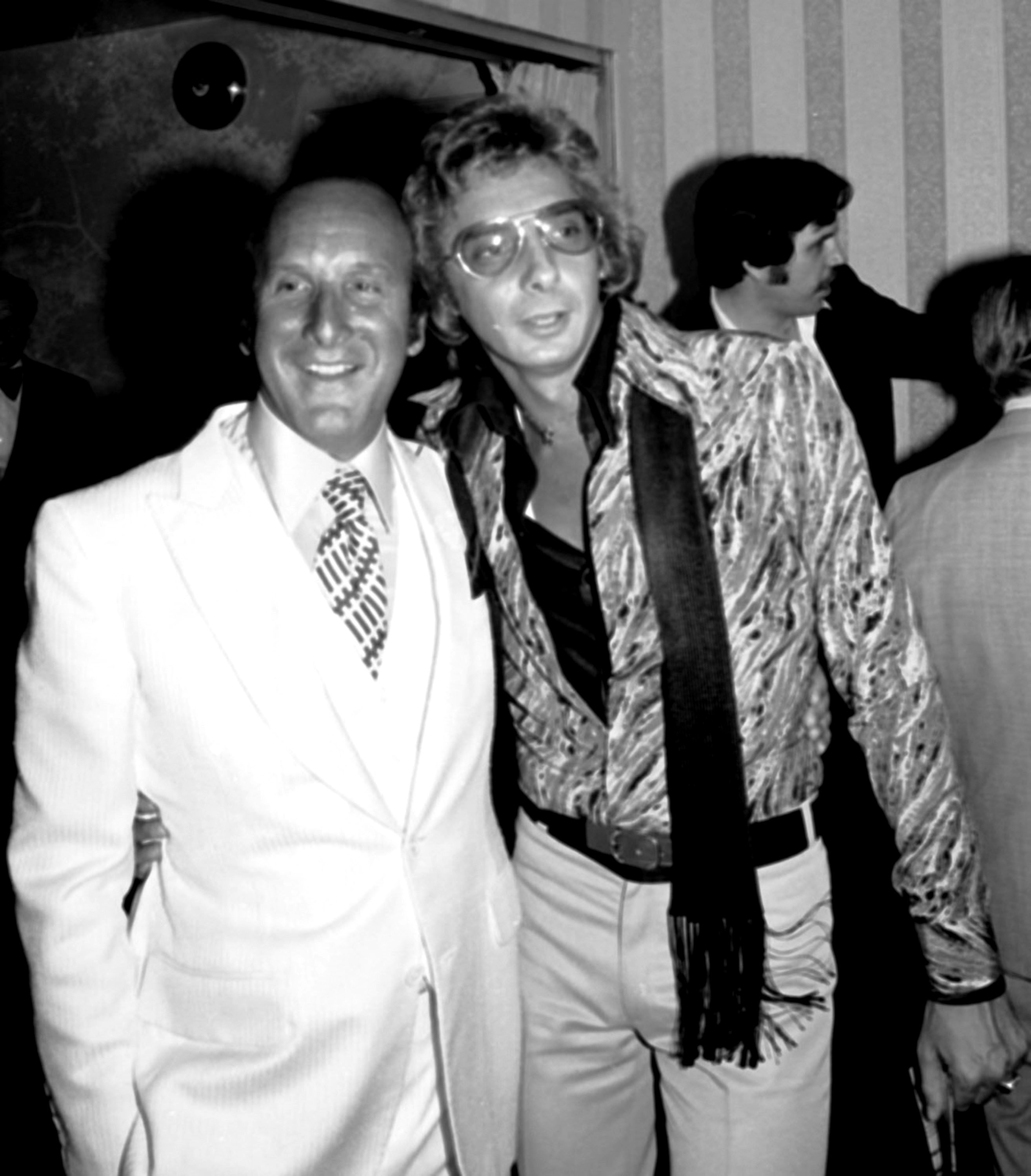 Clive Davis was influential in the creation of many hits. On this occasion, he posed with Barry Manilow in New York City, New York, on February 12, 1975. | Source: Getty Images