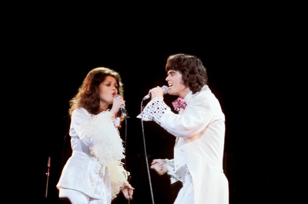Marie and Donnie Osmond performing on stage | Source: Getty Images