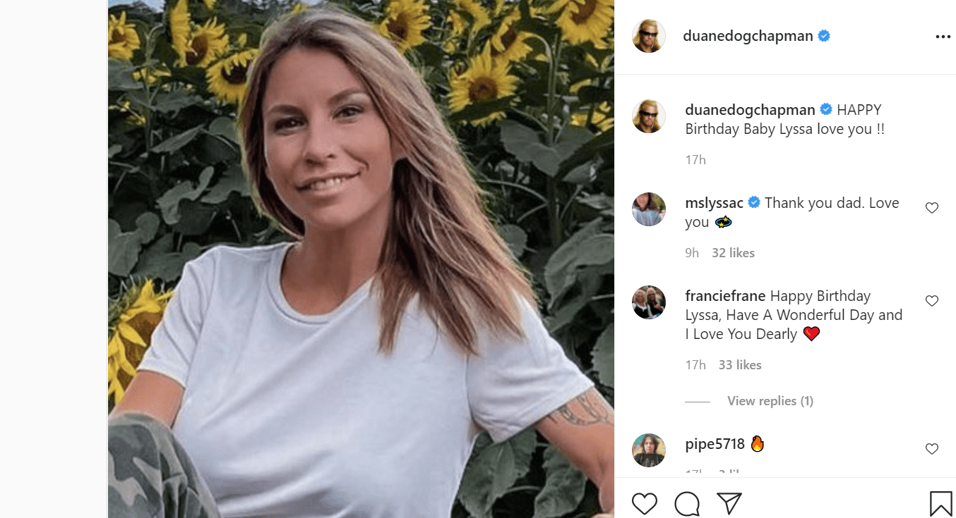 Pictured - A photo of Lyssa Chapman smiling wearing a white tee with camouflage pants | Source: Instagram/@duanedogchapman