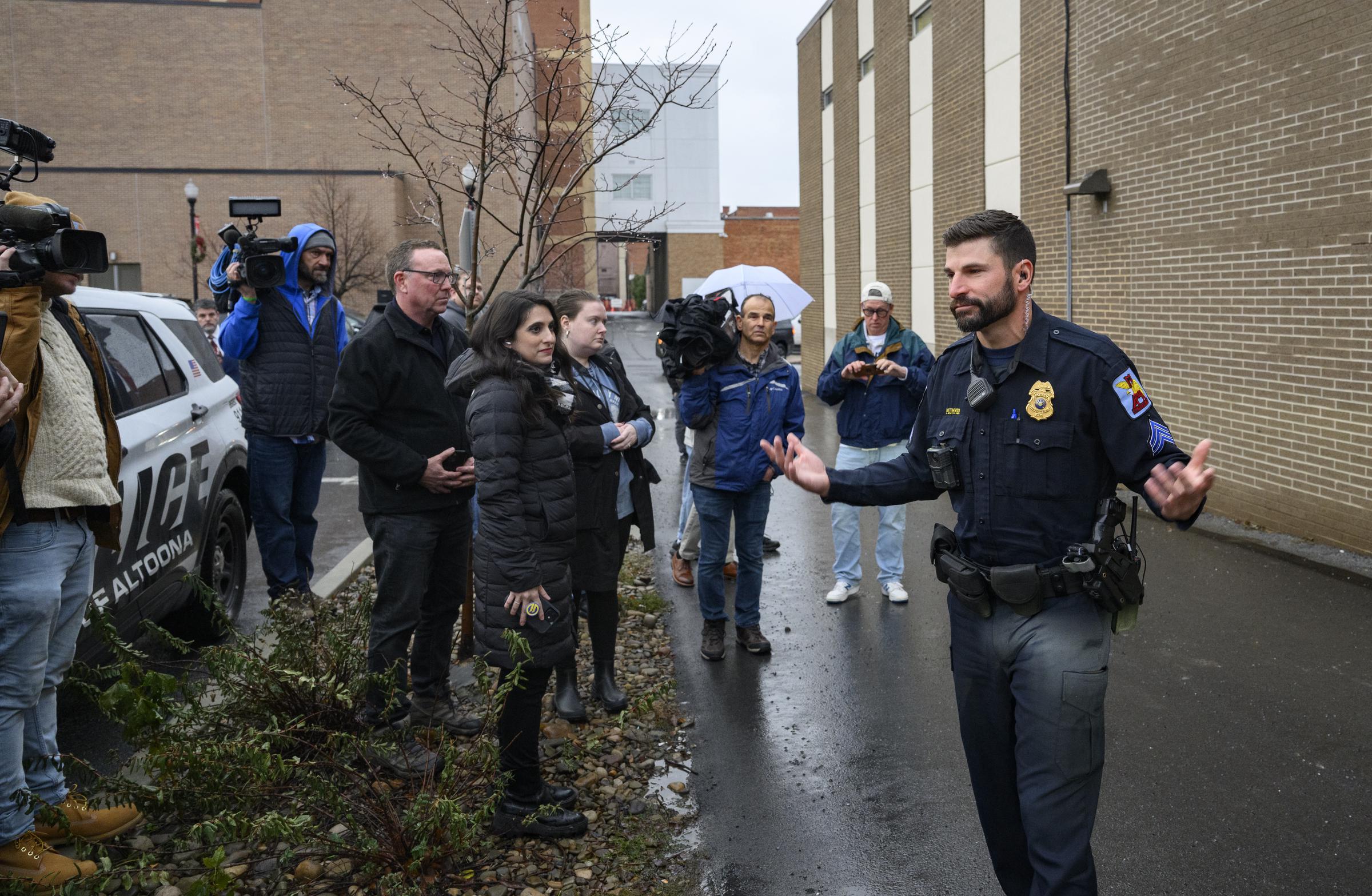 An Altoona Police officer briefs the media in Altoona, Pennsylvania, on December 9, 2024 | Source: Getty Images