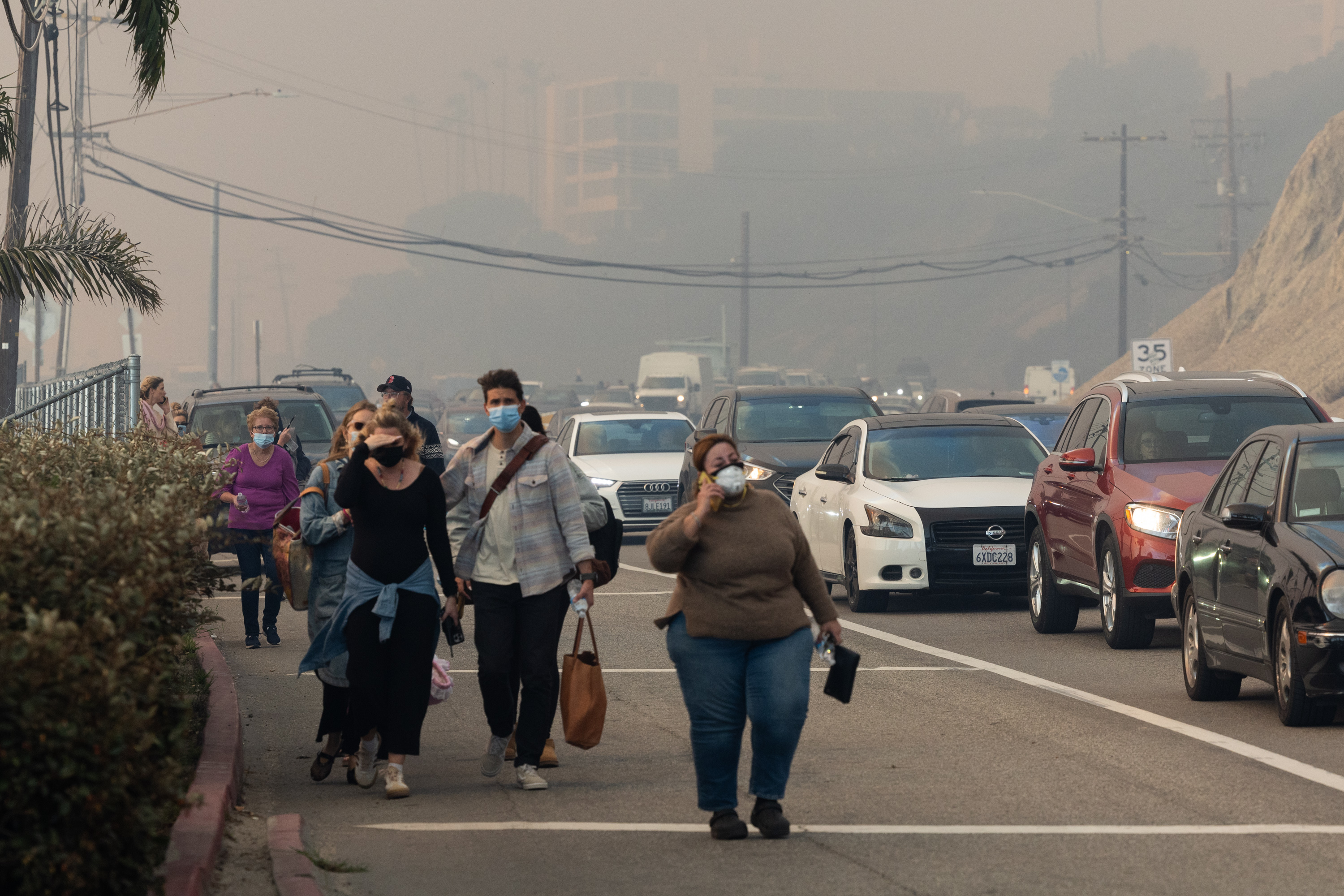 Residents evacuating their homes due to the brush fire in Pacific Palisades, California on January 7, 2025. | Source: Getty Images