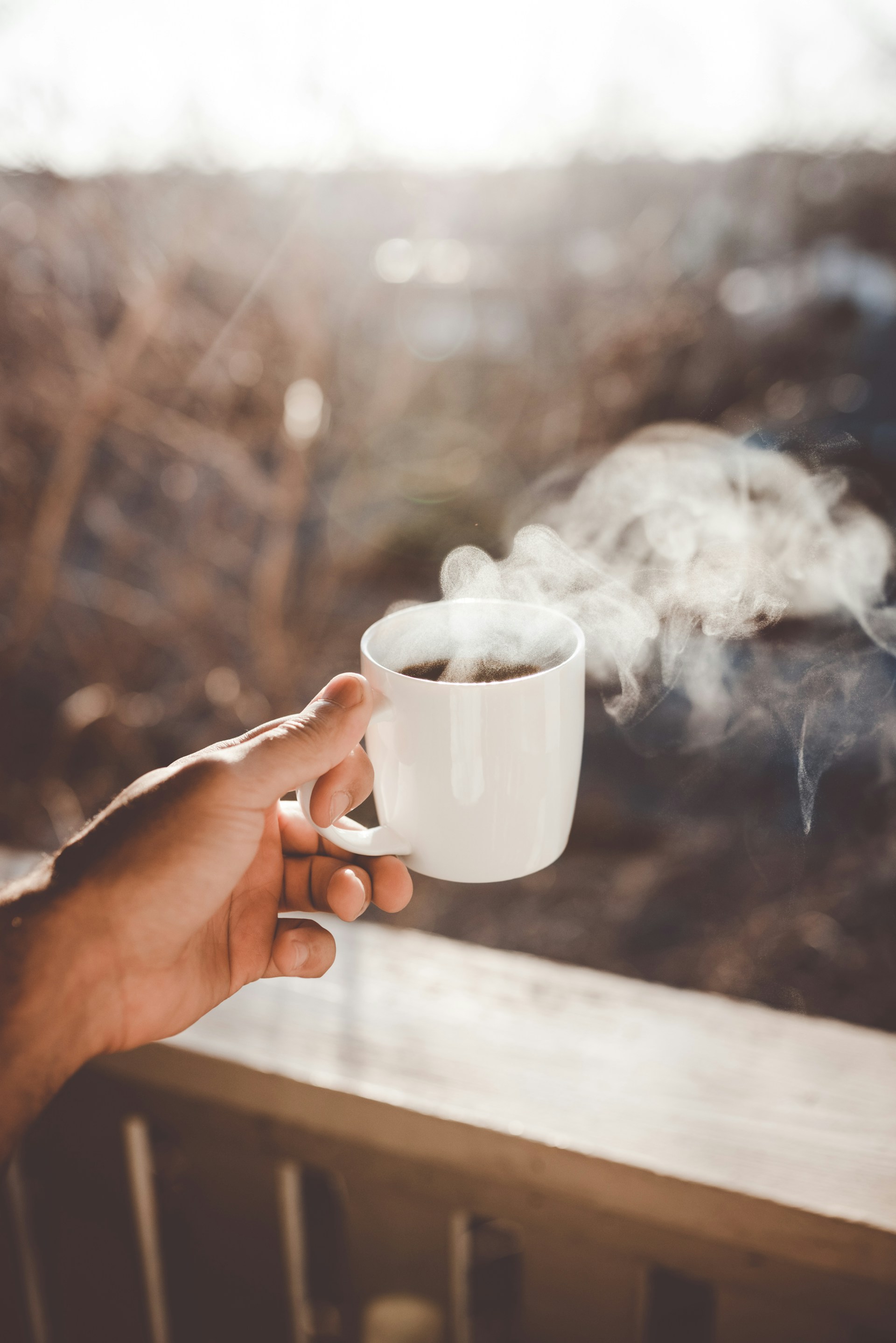 A person holding a coffee cup | Source: Unsplash