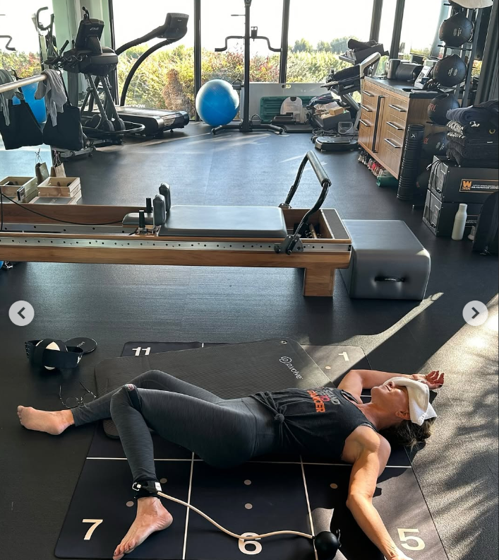Jennifer Aniston is pictured lying on a yoga mat, dated September 7, 2025 | Source: Instagram/jenniferaniston