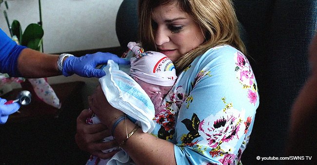 Woman who suffered 6 miscarriages bursts into tears when surrogate hands over her baby