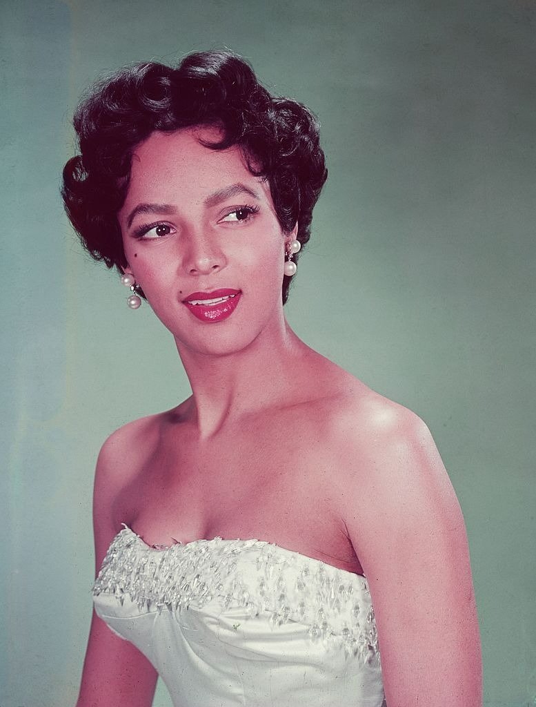 Headshot portrait of American actor Dorothy Dandridge wearing a white strapless dress with a beaded bodice, looking to the side | Photo: Getty Images