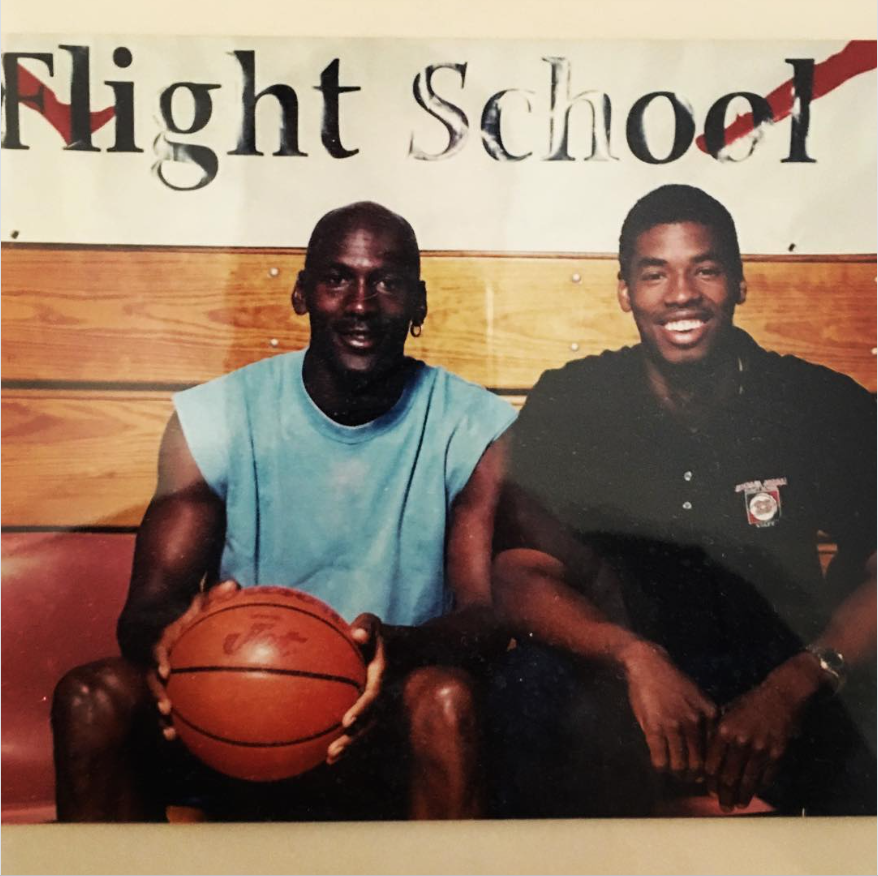 A young Jason Collins poses beside basketball legend Michael Jordan while attending “Flight School." | Source: Instagram/jasoncollins_98