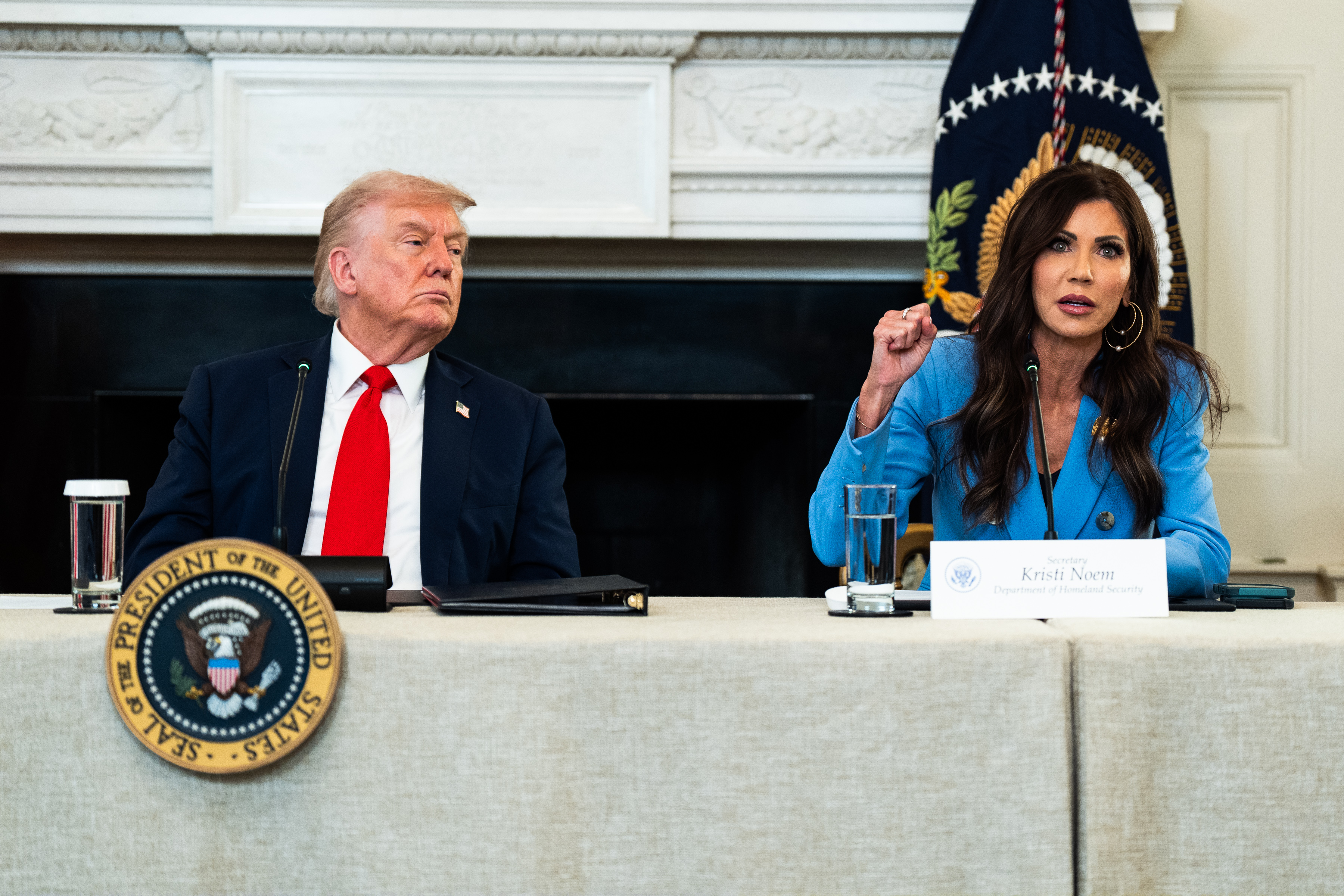 Donald Trump and Kristi Noem speak at an ANTIFA roundtable in the State Dining Room at the White House, October 8, 2025 | Source: Getty Images